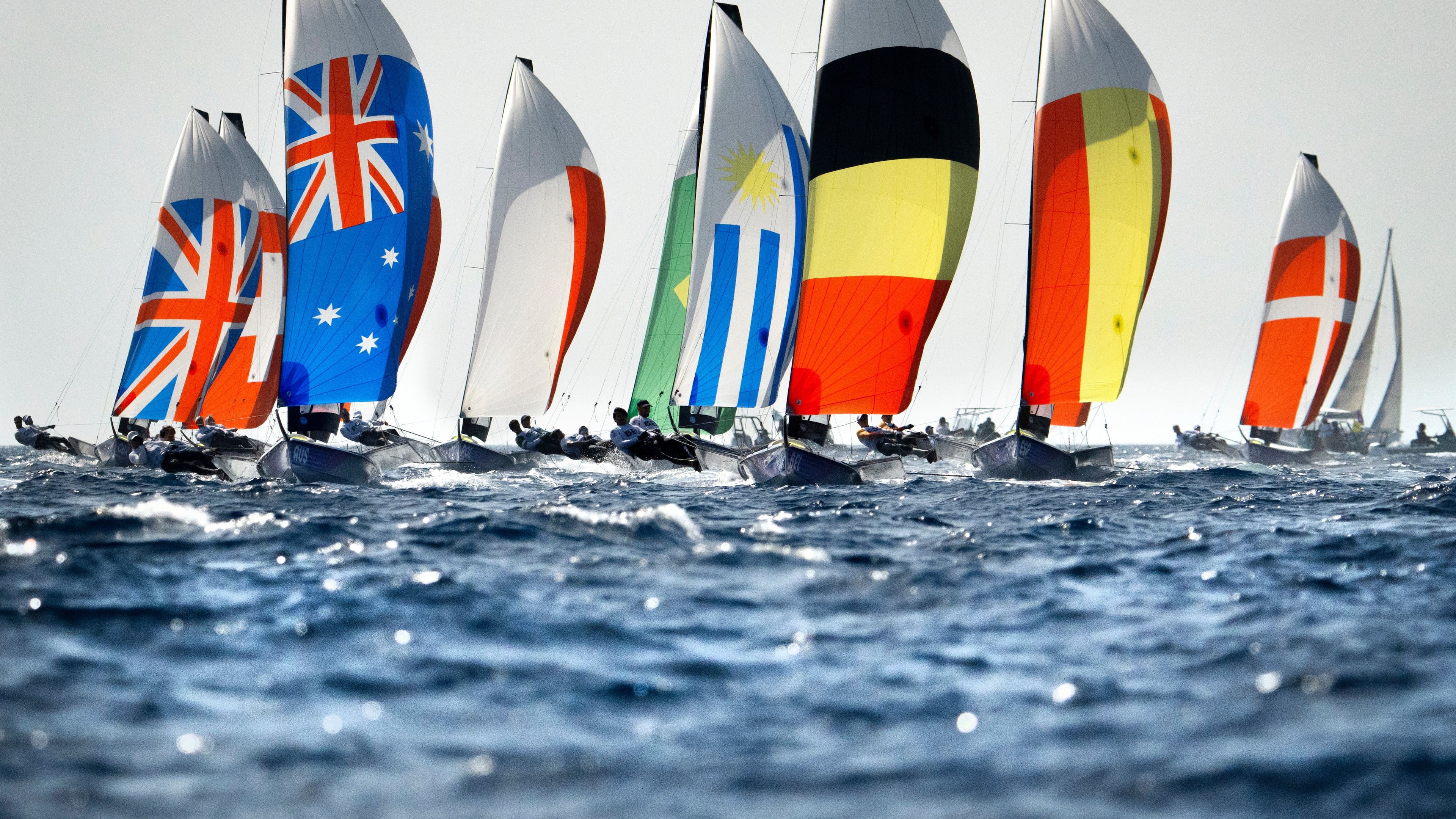 FILE - A fleet of boats from around the world compete in a men's skiff event sailing race Sunday July 28, 2024, during 2024 Summer Olympics sailing competition in Marseille, France. (AP Photo/Jacquelyn Martin, File)
