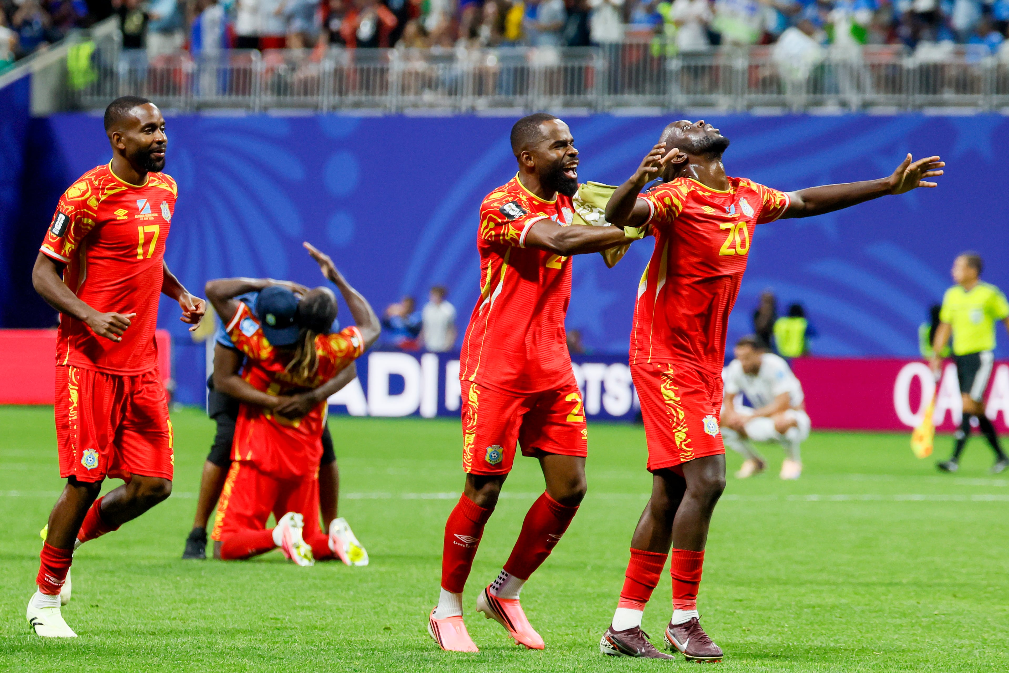Congo forward Yoane Wissa (right) celebrates with defender Gédéon Kalulu as teammate Fiston Mayele drops to his knees in the background after a 3-1 win against Uzbekistan after the second half of a FIFA World Cup match at Atlanta Stadium (Mercedes-Benz Stadium) on Saturday, June 27, 2026, in Atlanta. (Miguel Martinez/AJC)
