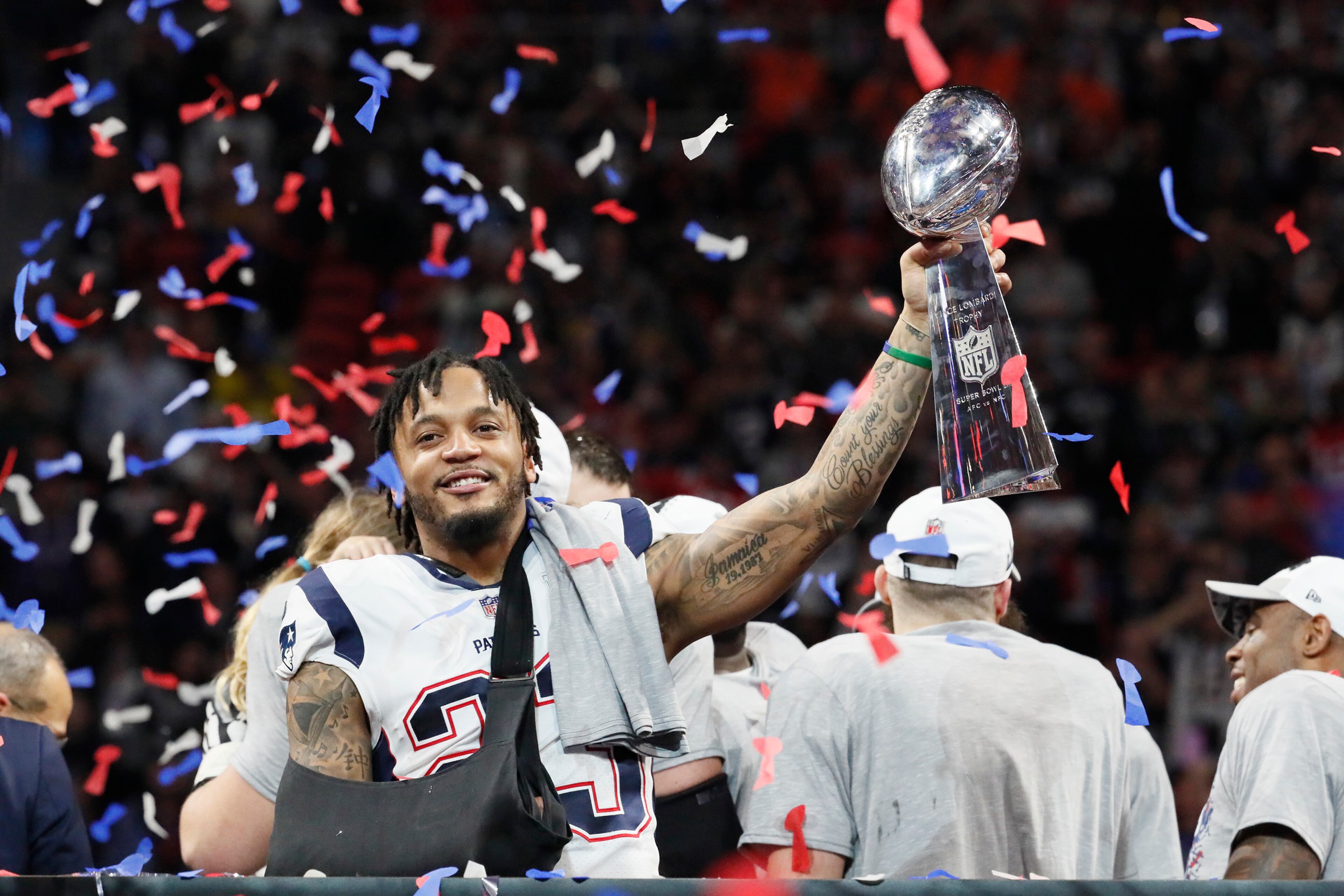 2/3/19 - Atlanta - New England Patriots strong safety Patrick Chung (23) with the Vince Lombardi trophy after defeating the Los Angeles Rams on Sunday, Feb. 3, 2019 in Super Bowl LIII at Mercedes-Benz Stadium in Atlanta, Ga. Bob Andres / bandres@ajc.com