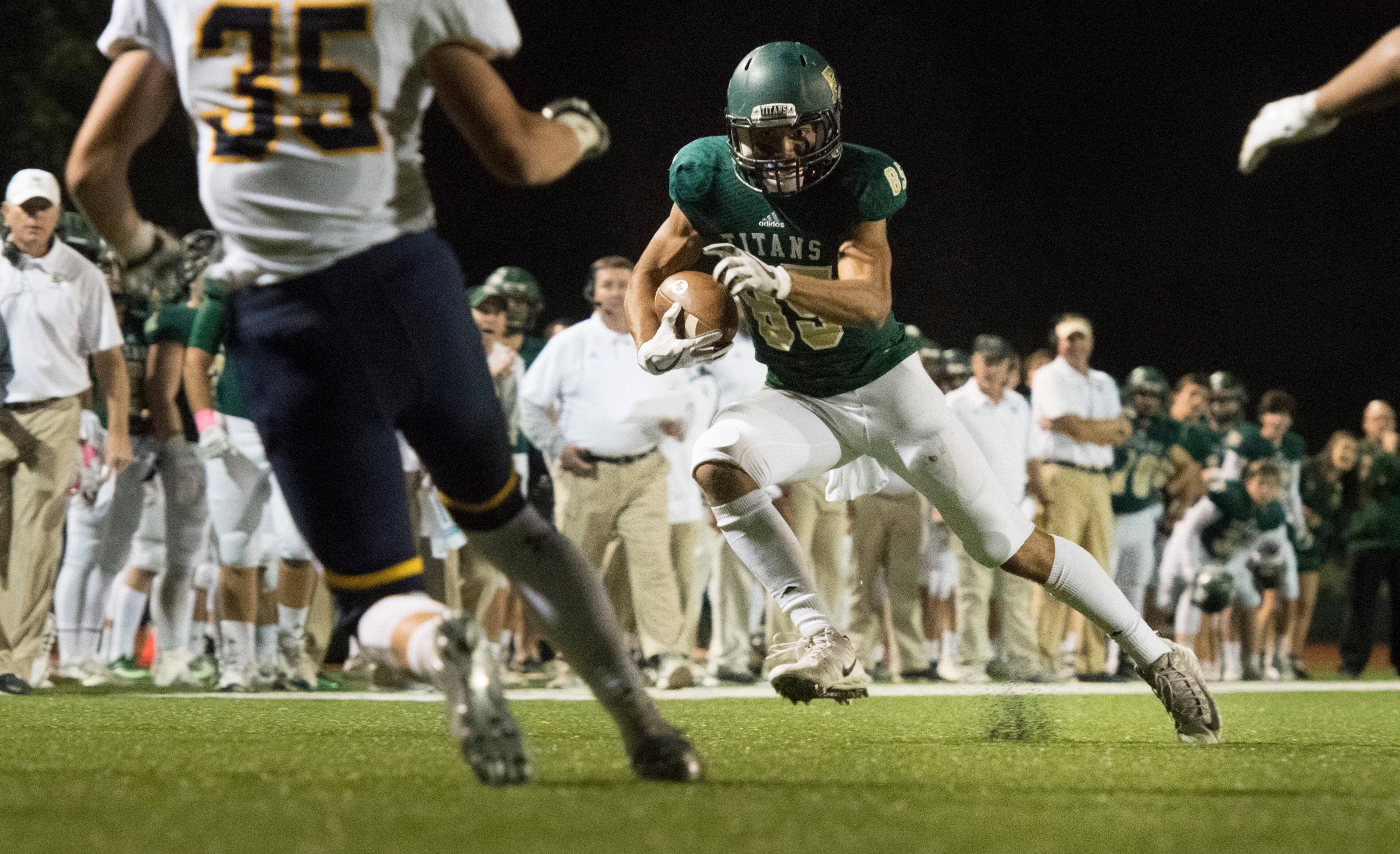 Blessed Trinity WR Will Carlton (85) runs as Marist's Ben Rosing (35) defends during a high school football game, Friday, Oct. 20, 2017, in Roswell. (John Amis)