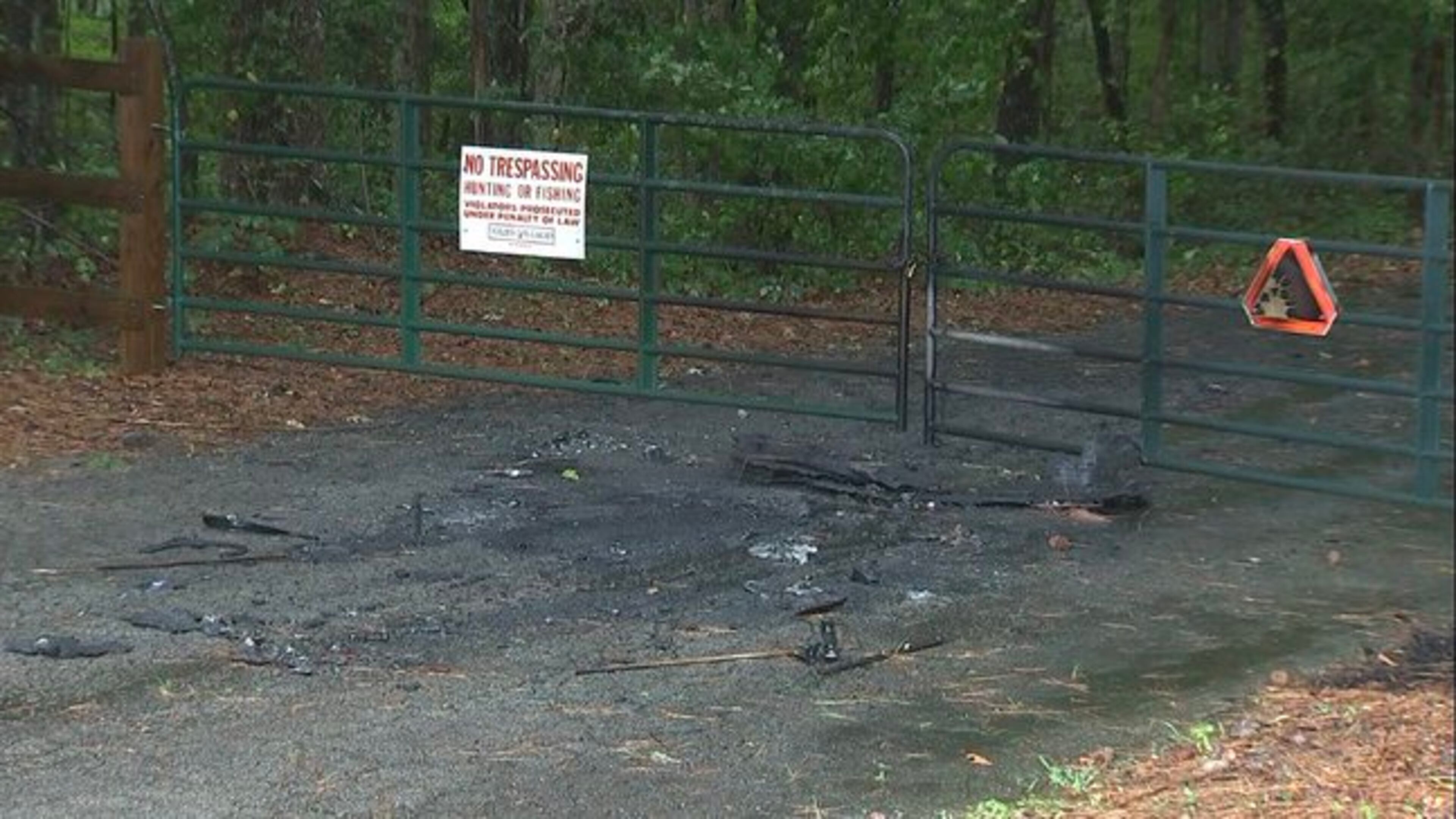 The body was found after someone called 911 and reported a burning car.