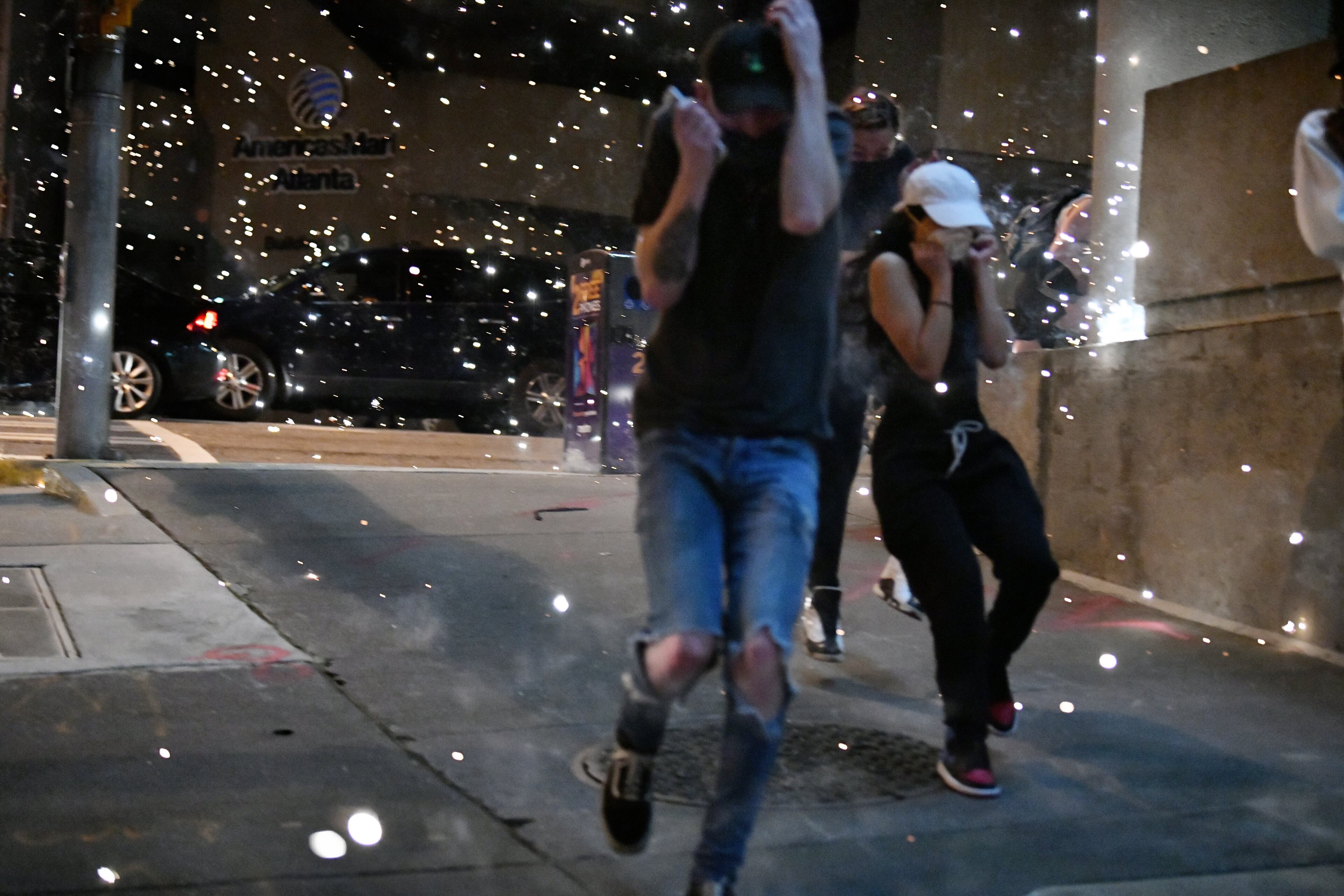 May 30, 2020 Atlanta - Fireworks got set off as the city of Atlanta was under a 9pm curfew as protests continued for a second day in downtown Atlanta on Saturday, May 30, 2020. A second day of protests Saturday began with a crowd outside the Governorâs Mansion and grew to include demonstrations in downtown Atlanta. Mayor Keisha Lance Bottoms implemented a curfew for the city following a night of chaotic protests Friday that led to vandalism and looting in parts of downtown Atlanta and Buckhead. (Hyosub Shin / Hyosub.Shin@ajc.com)