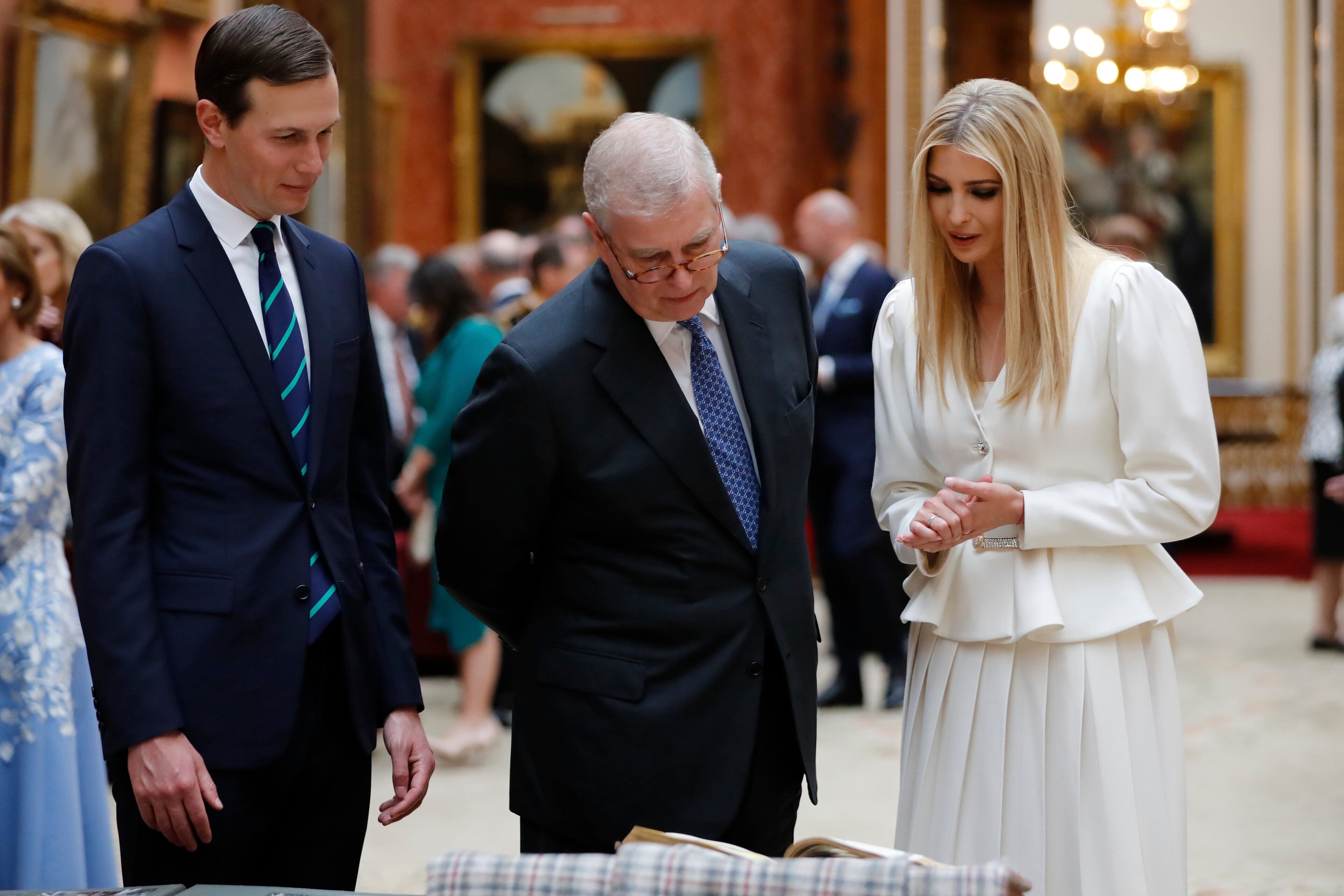 Britain's Prince Andrew, center, talks with Ivanka Trump and her husband Senior Advisor to the President of the United States Jared Kushner as they view U.S memorabilia from the Royal Collection, at Buckingham Palace, London, Monday, June 3, 2019. Trump is on a three-day state visit to Britain. (Tolga Akmen/Pool Photo via AP)