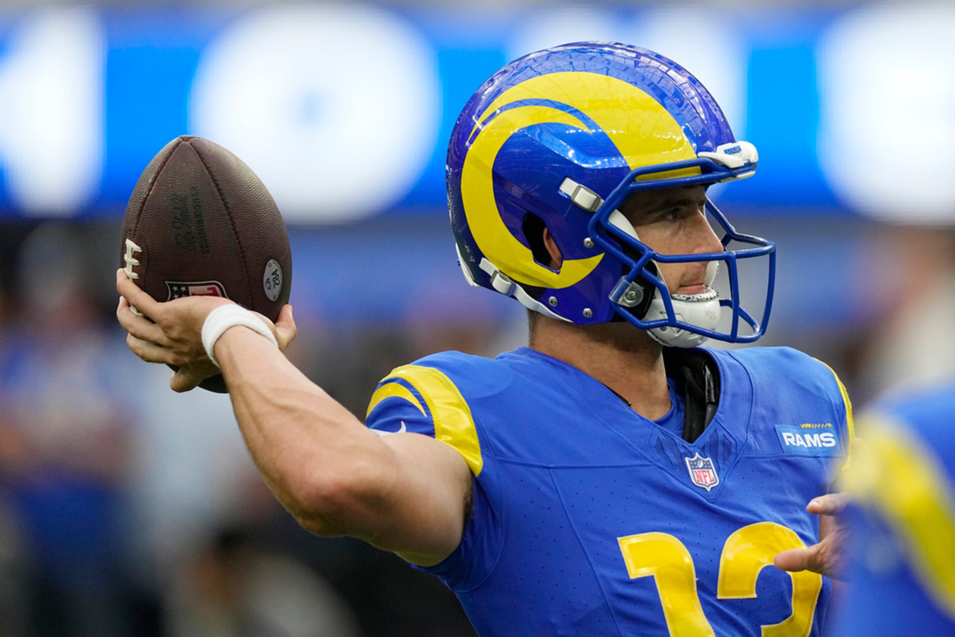 Los Angeles Rams quarterback Stetson Bennett warms up before a preseason NFL football game against the Las Vegas Raiders Saturday, Aug. 19, 2023, in Inglewood, Calif. (AP Photo/Mark J. Terrill)