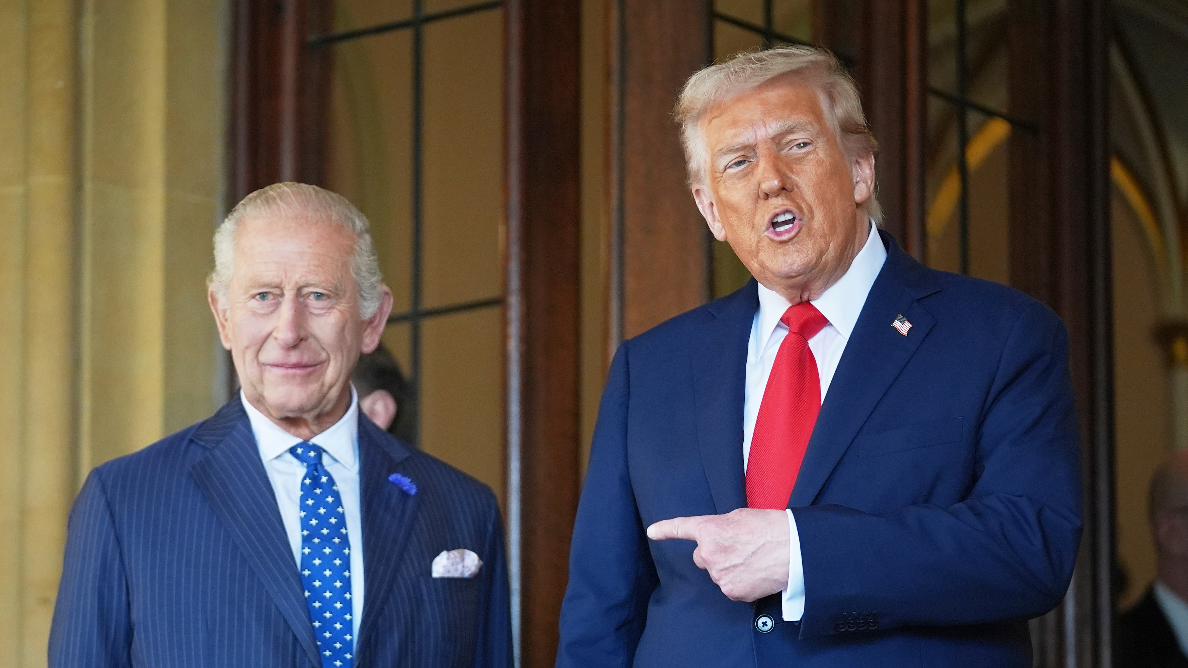 FILE - President Donald Trump gestures next to Britain's King Charles III before leaving Windsor Castle, Windsor, England, Sept. 18, 2025. (AP Photo/Evan Vucci, file)