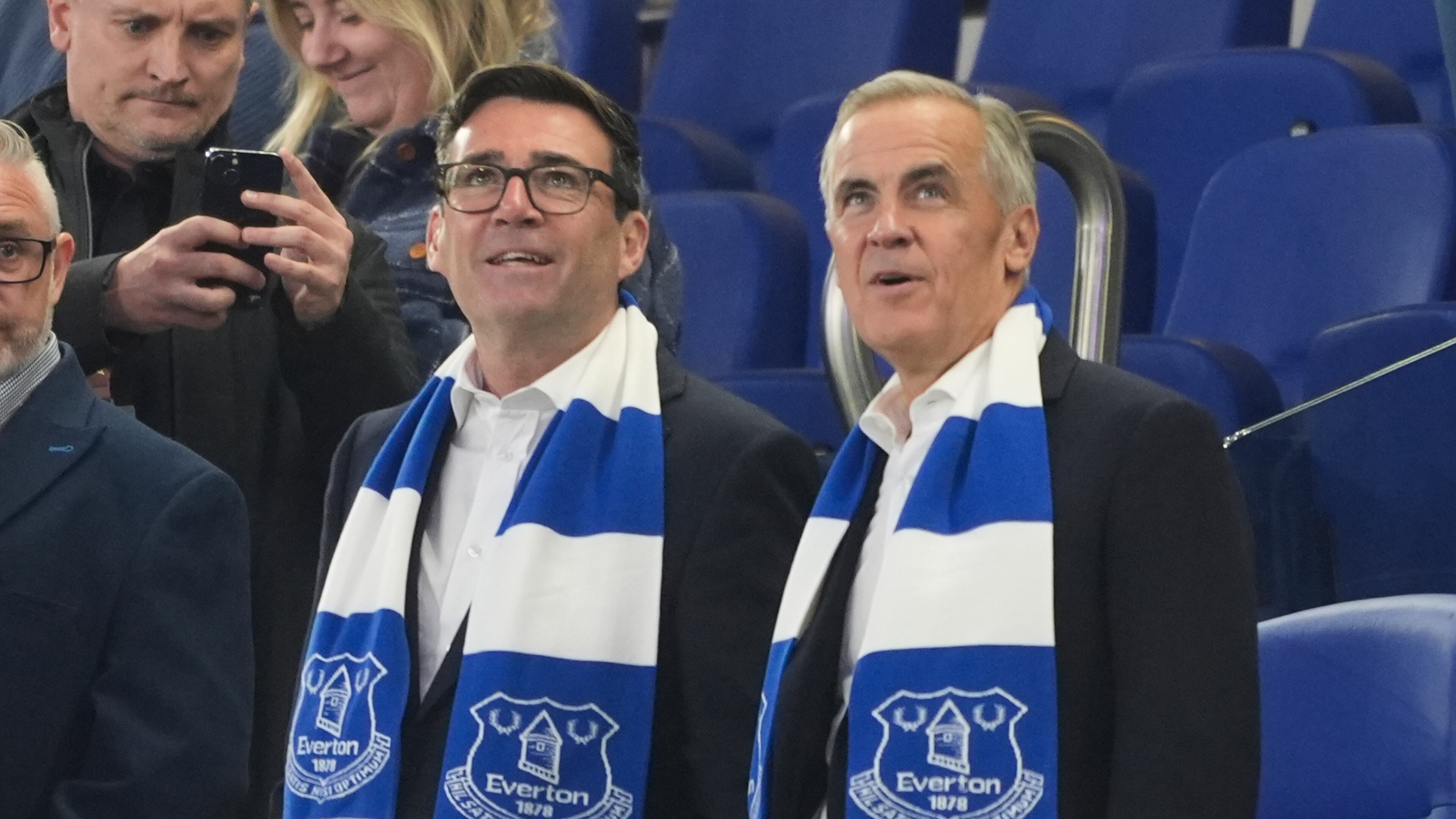 Britain's Prime Minister Andy Burnham, left, and Canada's Prime Minister Mark Carney attend the League Cup third round round soccer match between Everton and Wolverhampton Wanderers, Wednesday, Sept. 16, 2026, in Liverpool, England. (Peter Byrne/PA via AP)