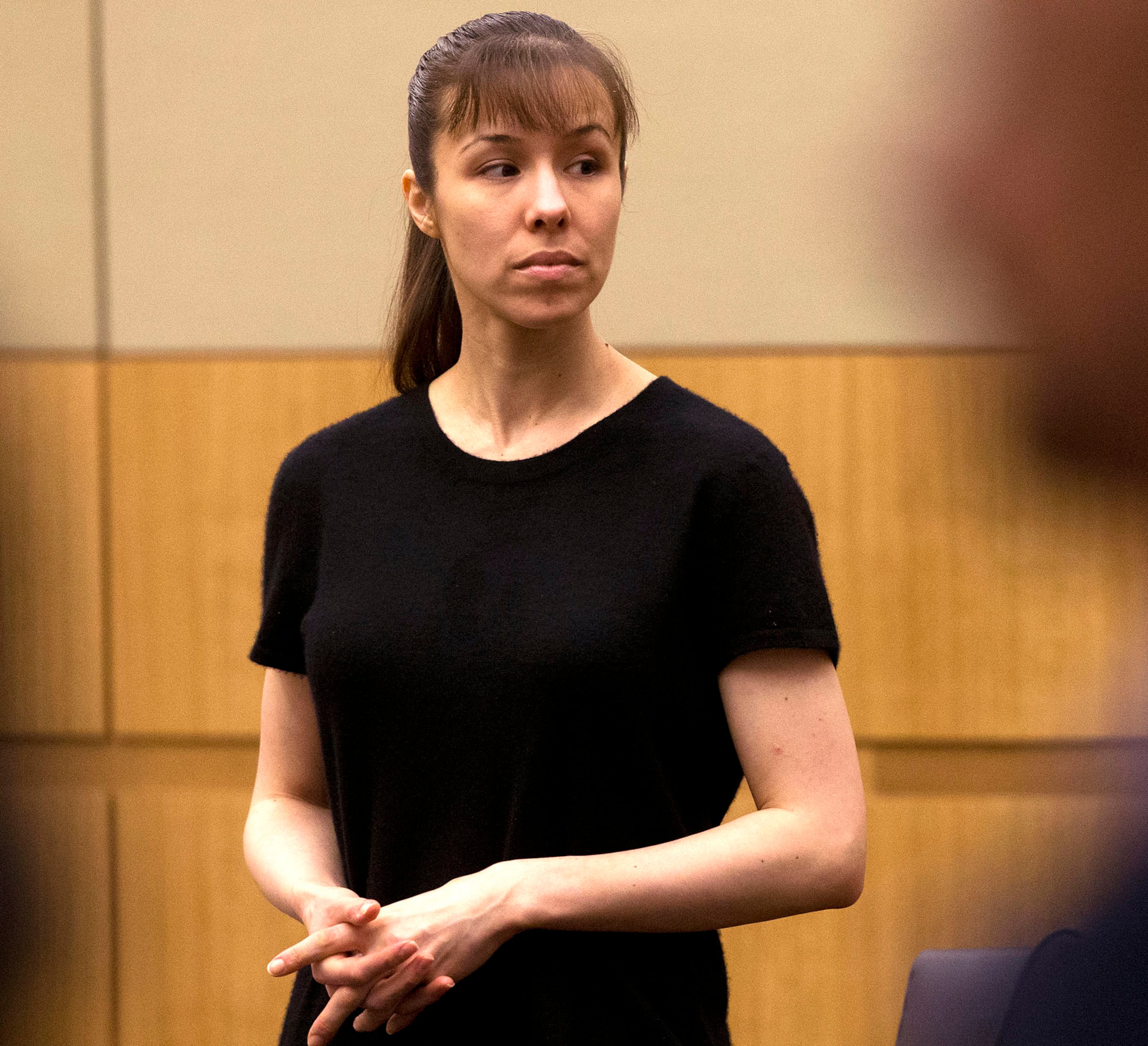 Jodi Arias stands as the jury enters the courtroom on Wednesday, May 22, 2013 during the penalty phase of her murder trial at Maricopa County Superior Court in Phoenix. Jodi Arias was convicted of first-degree murder in the stabbing and shooting to death of Travis Alexander. (AP Photo/The Arizona Republic, Rob Schumacher, Pool)