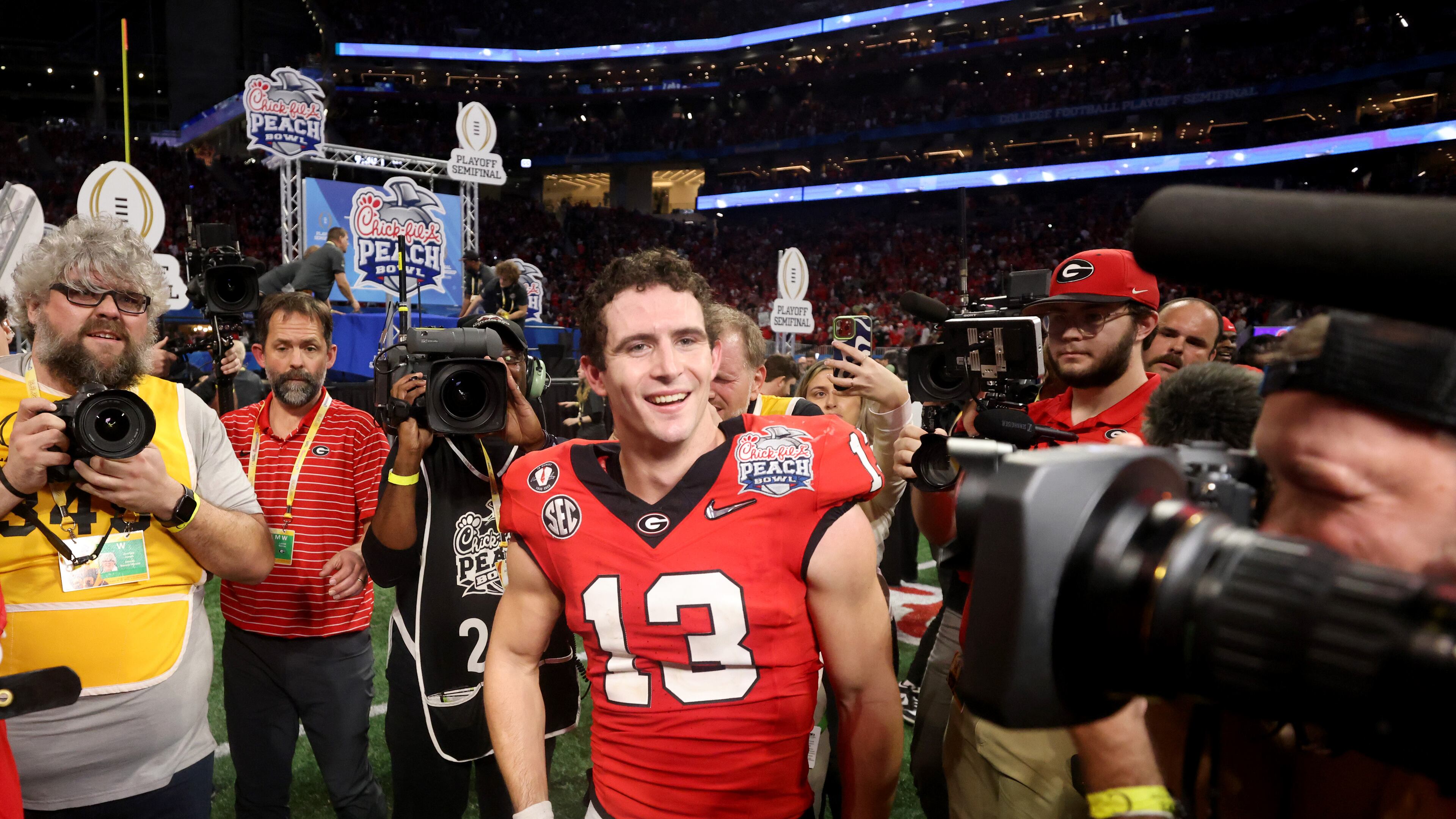 Georgia quarterback Stetson Bennett celebrates after his team's 42-41 win against Ohio State in the Peach Bowl. (Jason Getz / Jason.Getz@ajc.com)