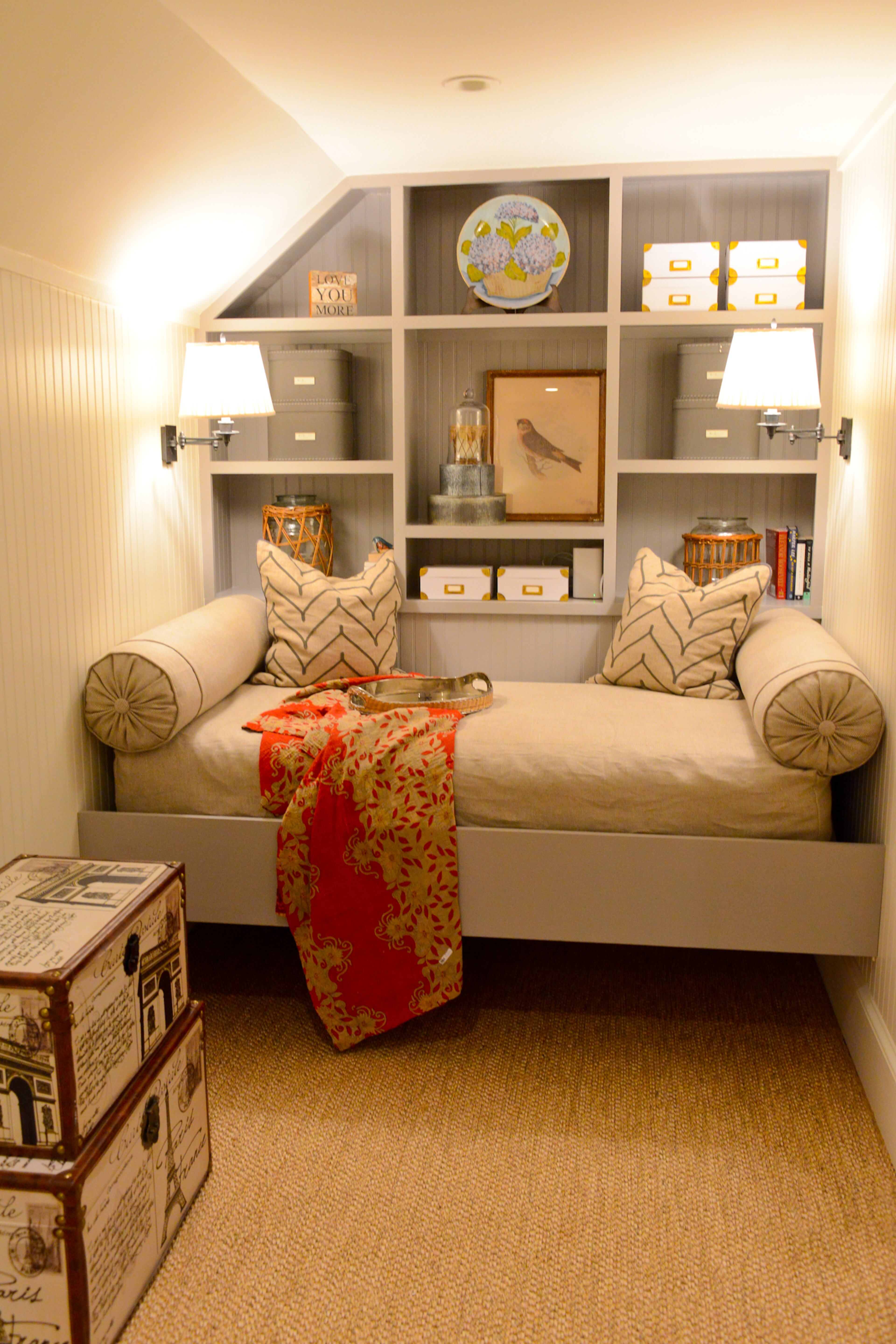 A built-in daybed and bookshelves create a cozy nook upstairs in one of the home's five bedrooms. The East Lake homeowners worked with interior designer Donna Campbell of Donna Campbell Home.