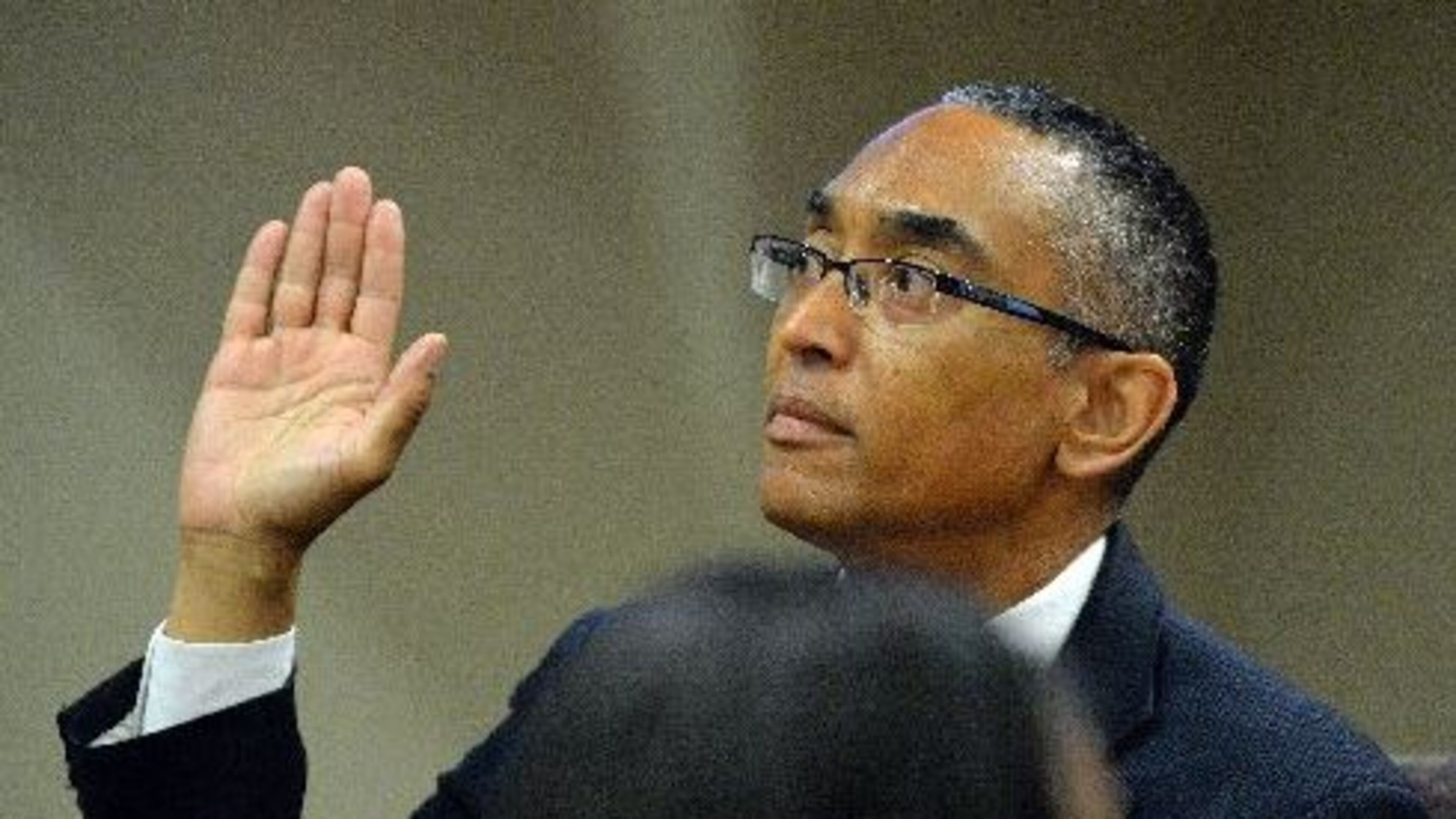 Suspended DeKalb County CEO Burrell Ellis is sworn in as he takes the stand in his defense Thursday afternoon. KENT D. JOHNSON /KDJOHNSON@AJC.COM