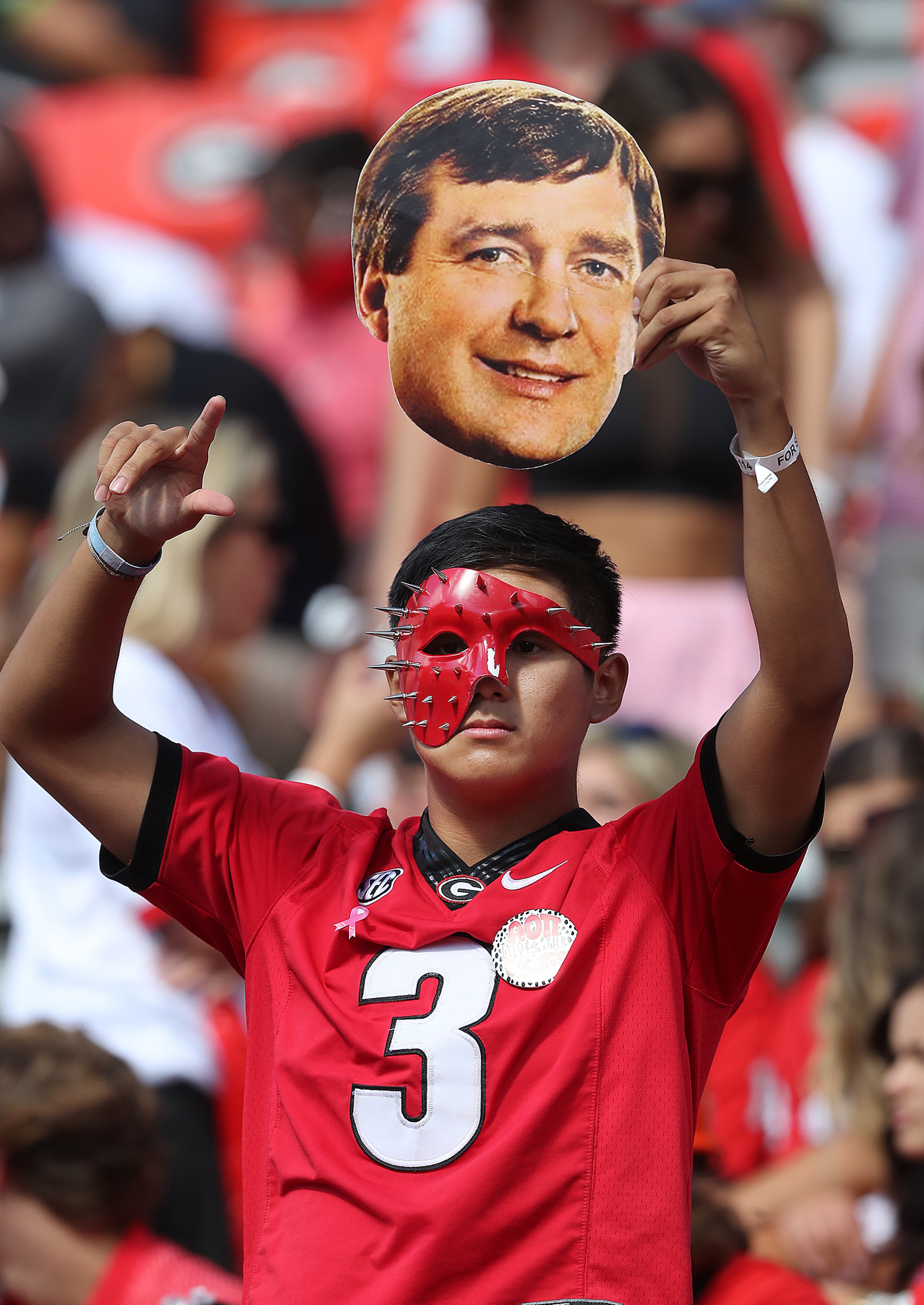 A Georgia fan cheers for head coach Kirby Smart and the team as they prepare to play Kentucky in a NCAA college football game on Saturday, Oct. 16, 2021, in Athens. Curtis Compton / Curtis.Compton@ajc.com