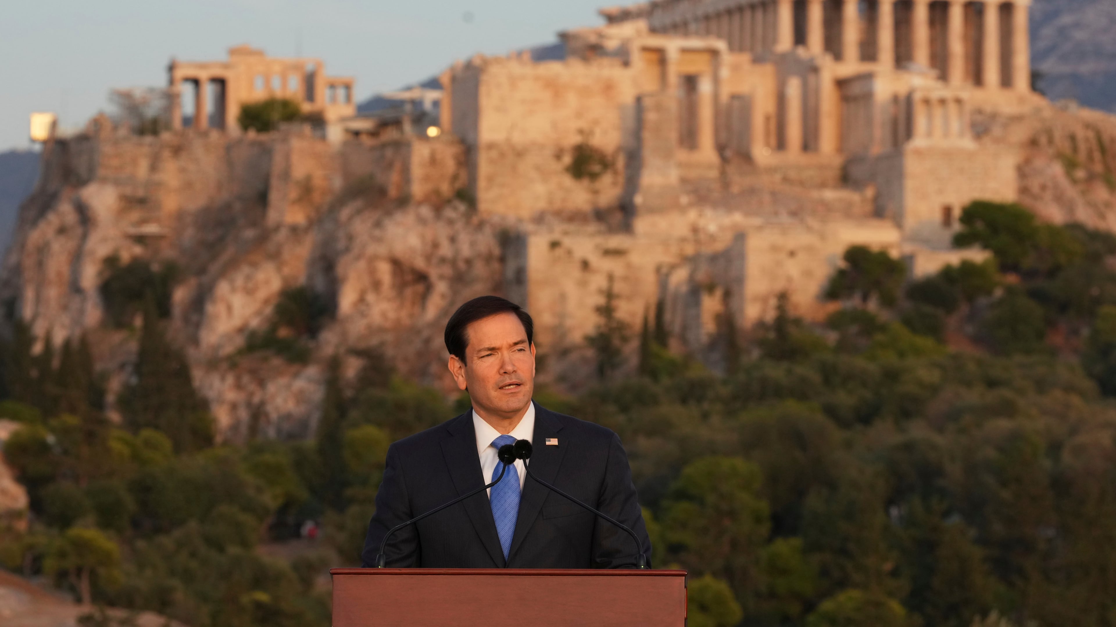 U.S. Secretary of State Marco Rubio speaks at the Pnyx hill, where ancient Athenians held democratic assemblies, with the ancient Parthenon temple atop the Acropolis in the background, in Athens,Wednesday, Oct. 7, 2026. (AP Photo/Mark Schiefelbein, Pool)