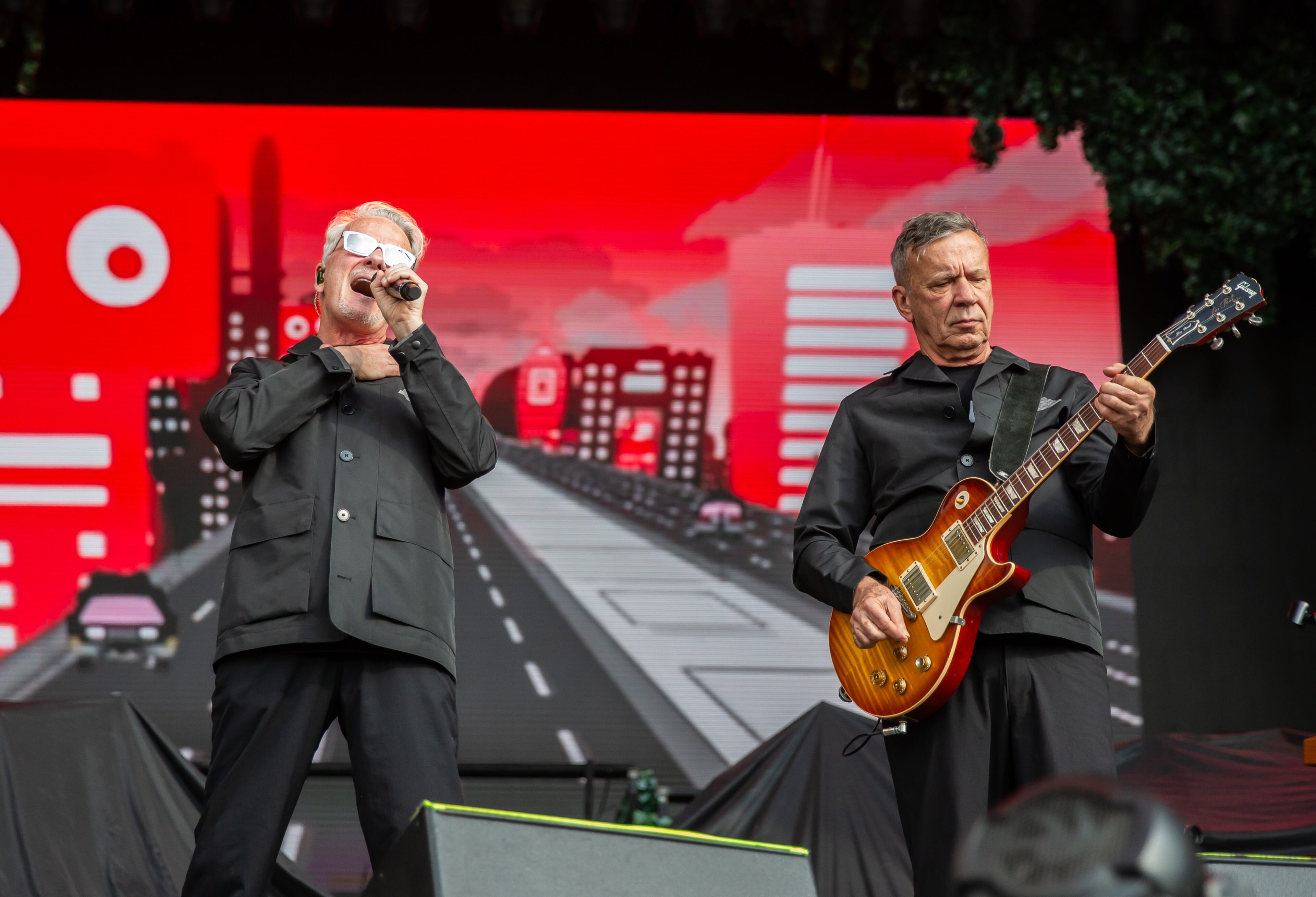 Atlanta, Ga. — New wave legends Devo took the Peachtree Stage and played classics like "Whip It" for adoring fans on Sunday, Sept. 21, 2025, at Piedmont Park. (RYAN FLEISHER FOR THE ATLANTA JOURNAL-CONSTITUTION)