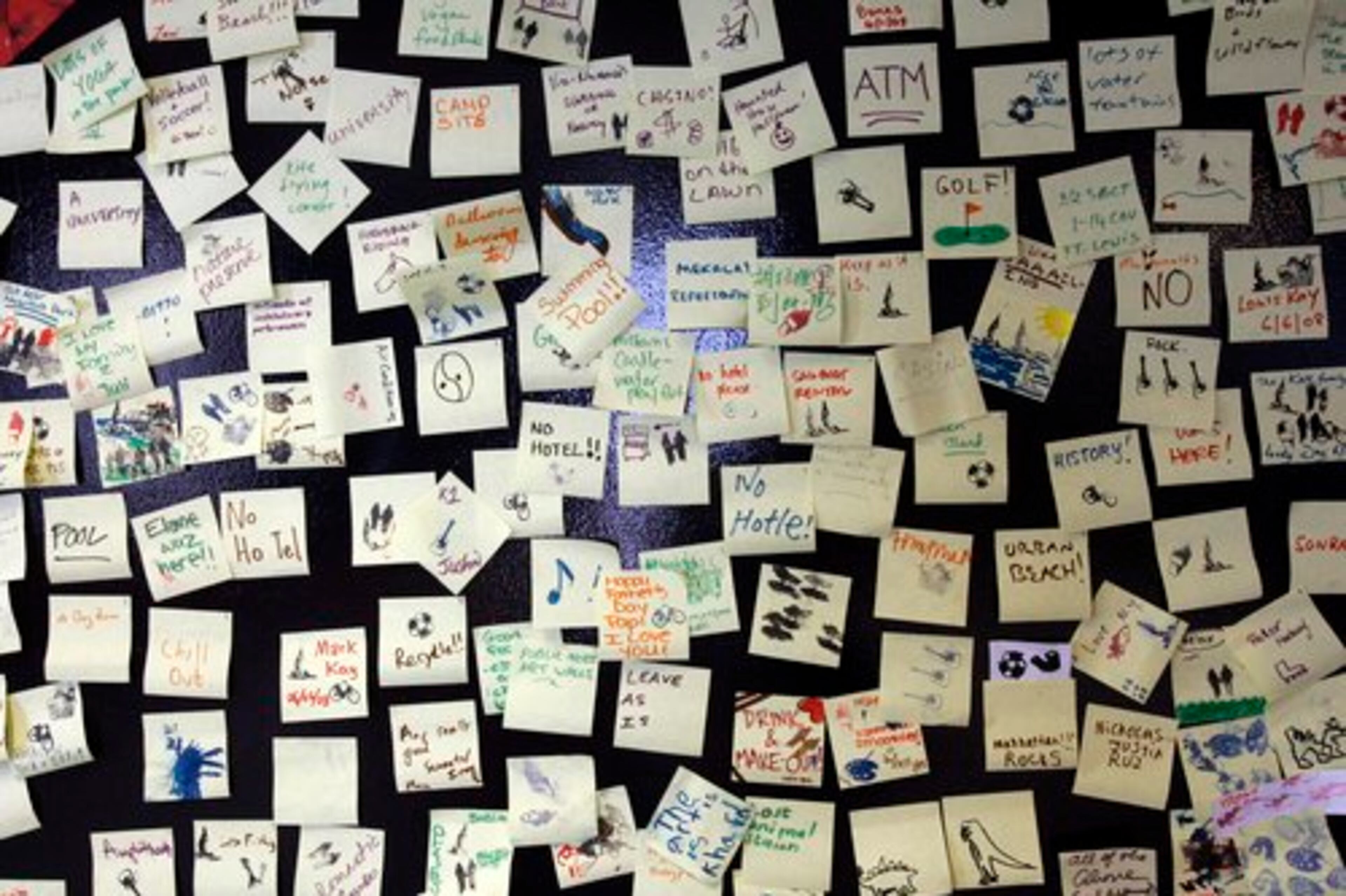 GUESTS leave their suggestions on sticky notes at the Governors Island visitors center.