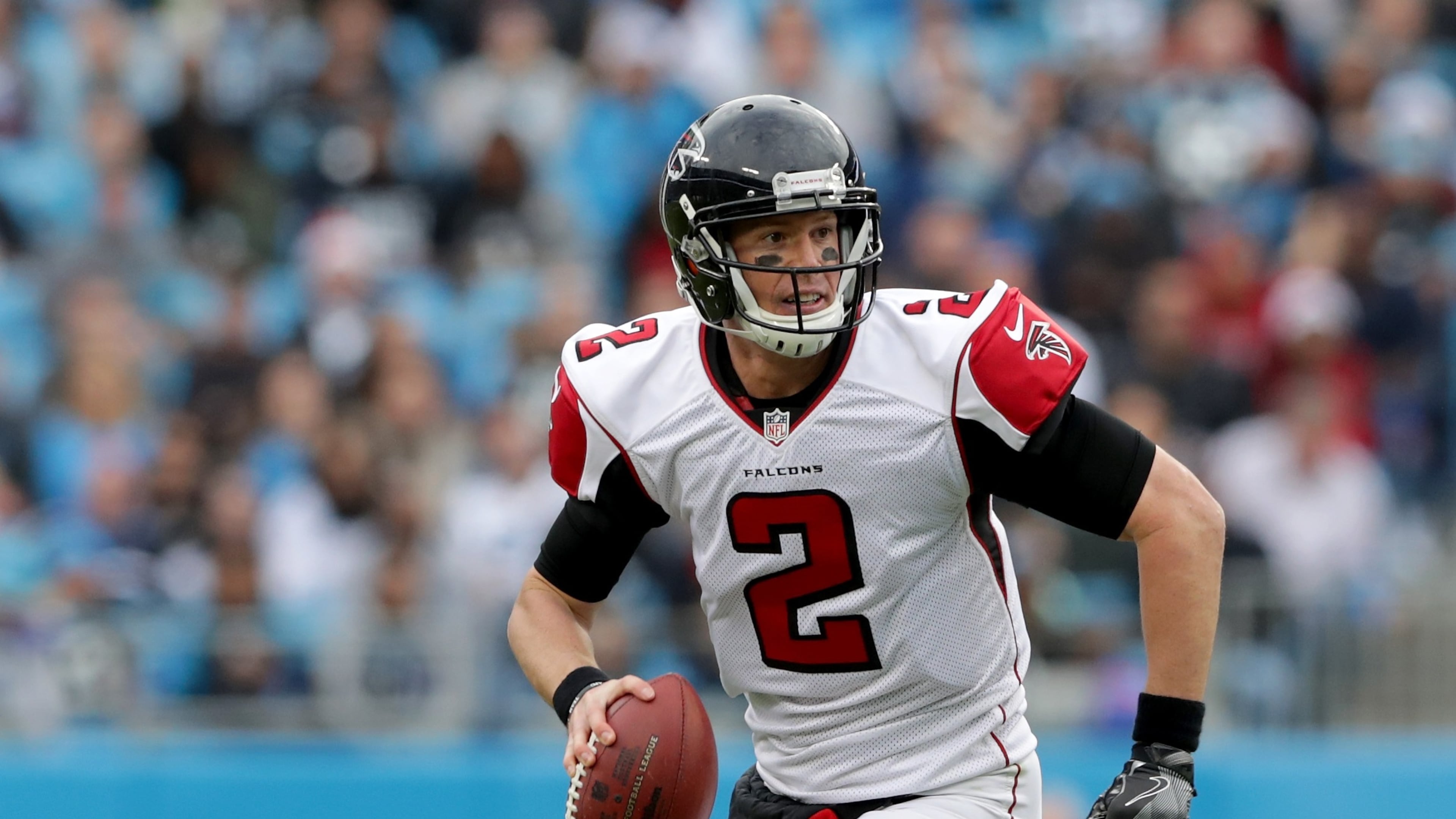 CHARLOTTE, NC - DECEMBER 24: Matt Ryan #2 of the Atlanta Falcons runs the ball against the Carolina Panthers in the 3rd quarter during their game at Bank of America Stadium on December 24, 2016 in Charlotte, North Carolina. (Photo by Streeter Lecka/Getty Images)