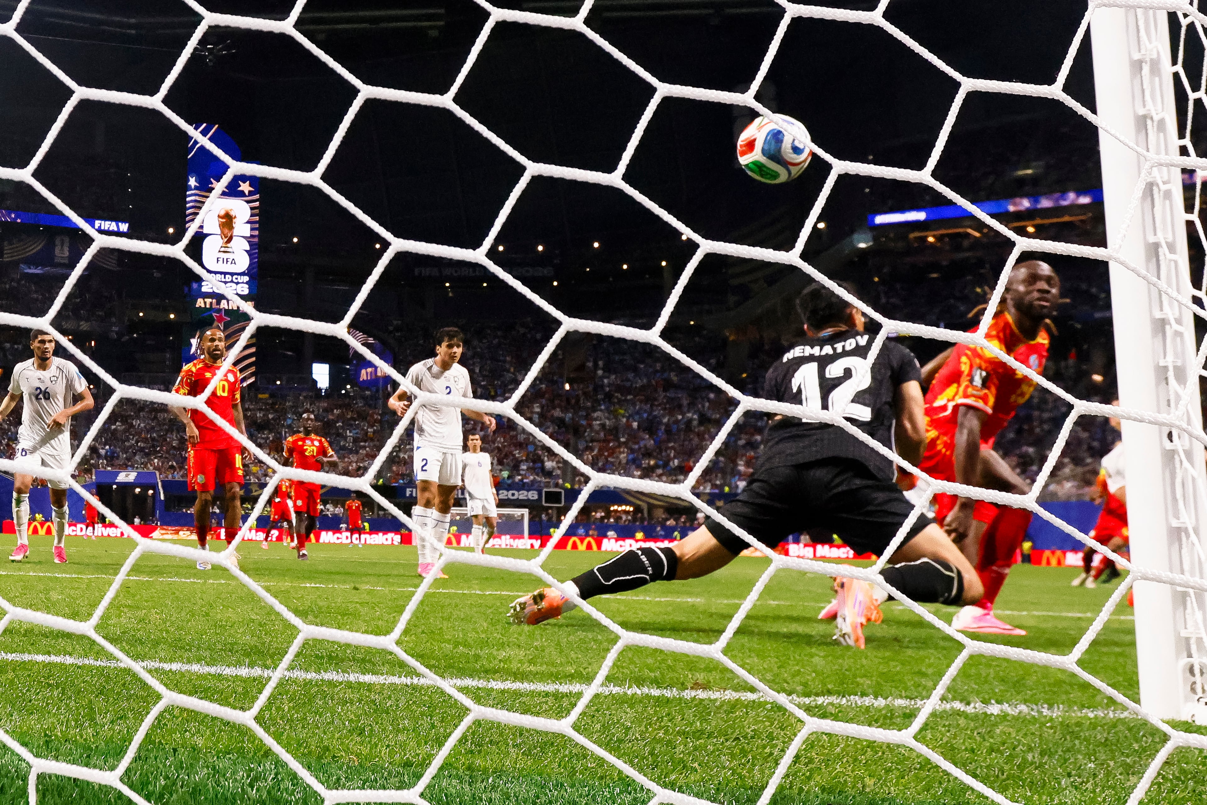 DR Congo forward Fiston Mayele (19) scores against Uzbekistan goalkeeper Abduvohid Nematov (12) during the second half of a FIFA World Cup match at Atlanta Stadium (Mercedes-Benz Stadium) on Saturday, June 27, 2026, in Atlanta. (Miguel Martinez/AJC)