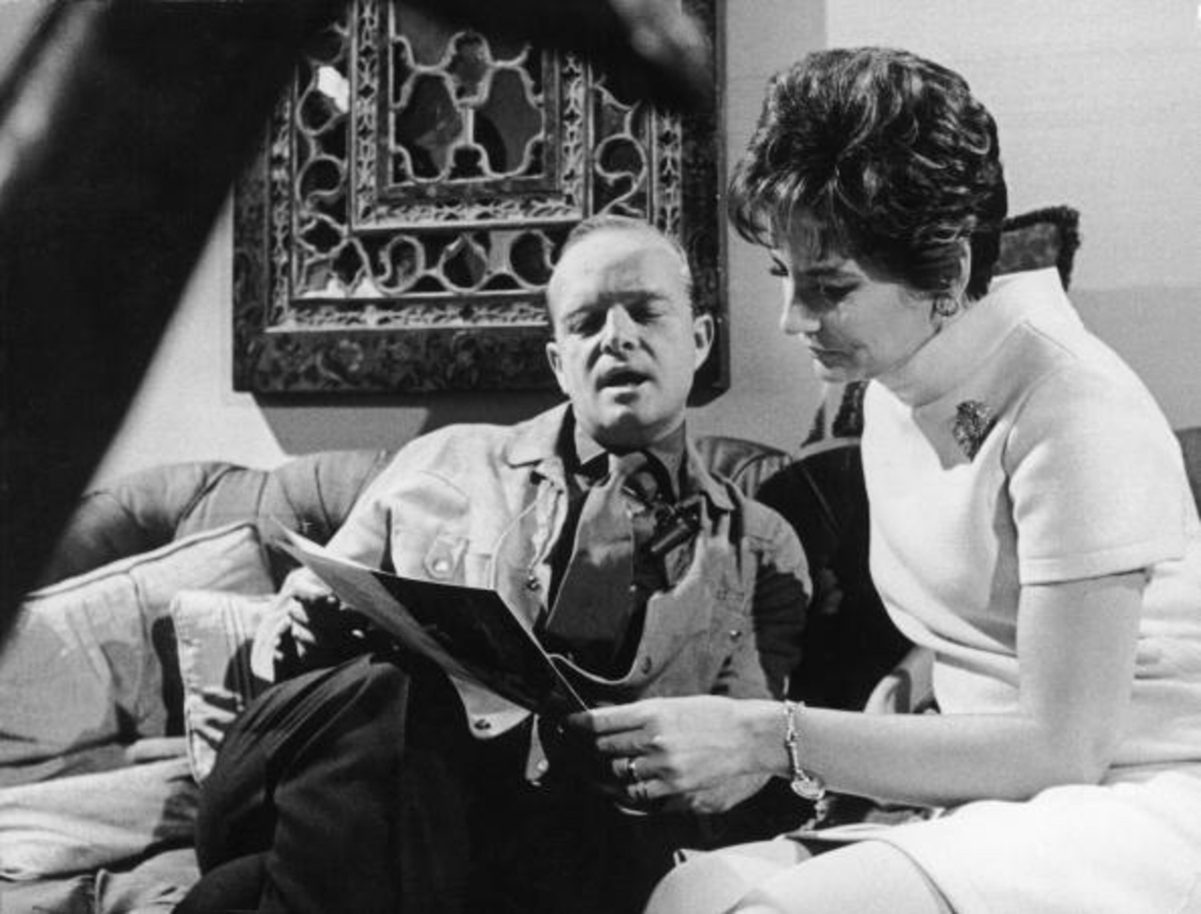 American broadcast journalist and media personality Barbara Walters looks at a pamphlet as she listens to American novelist, short story writer, and playwright Truman Capote (1924 - 1984) inside his New York City apartment, New York, December 1967. Walters is interviewing Capote for an upcoming segment on the NBC morning news show 'Today.' (Photo by Pictorial Parade/Getty Images)