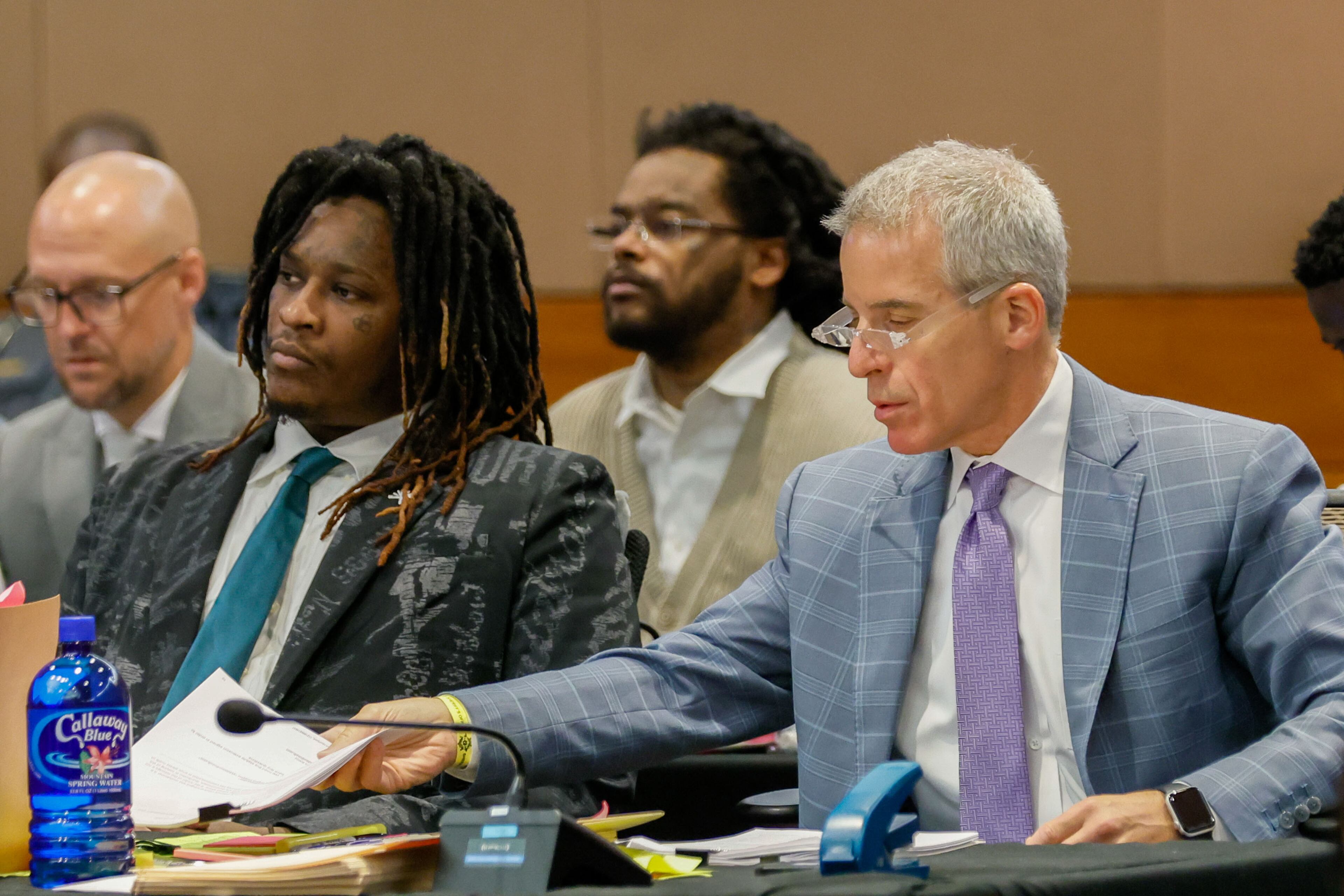 Atlanta rapper Young Thug, whose real name is Jeffery Williams, listens to Judge Peige Resse Withaker as his defense attorney, Brian Steel, goes through documents during a motion hearing at the Fulton County Courtroom on Tuesday, July 30, 2024.
(Miguel Martinez / AJC)
