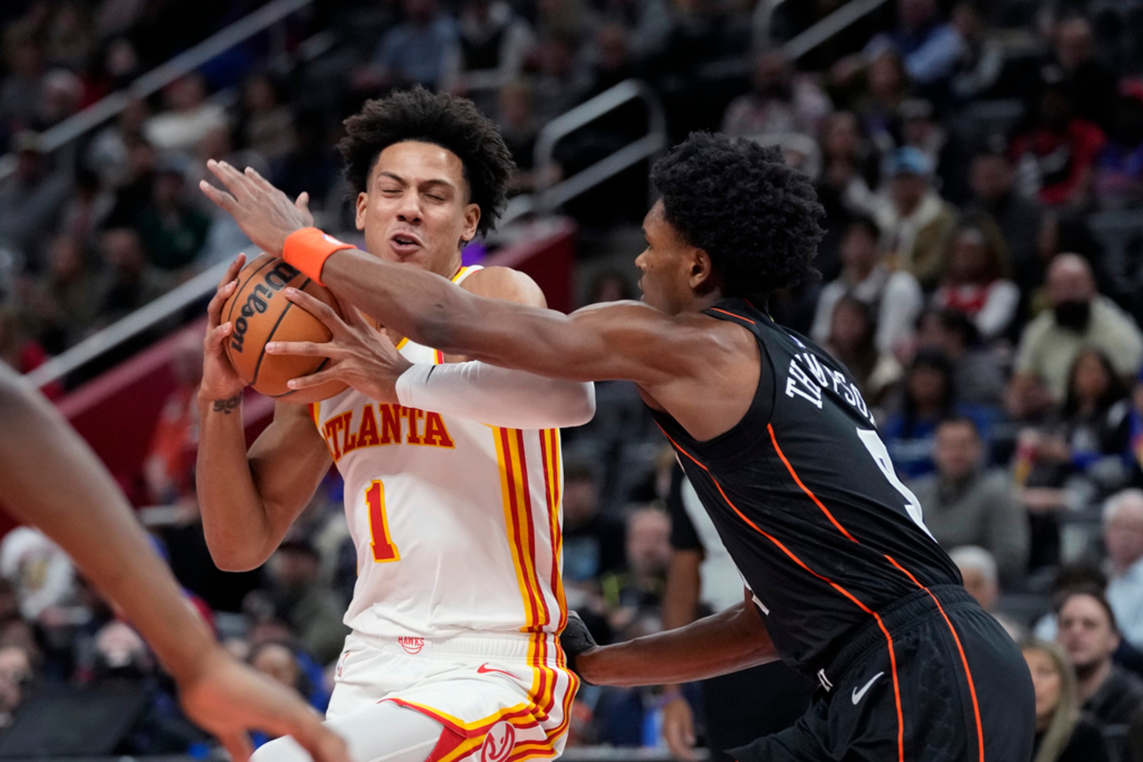 Atlanta Hawks forward Jalen Johnson (1) is fouled by Detroit Pistons forward Ausar Thompson (9) during the first half of an NBA basketball game, Tuesday, Nov. 14, 2023, in Detroit. (AP Photo/Carlos Osorio)