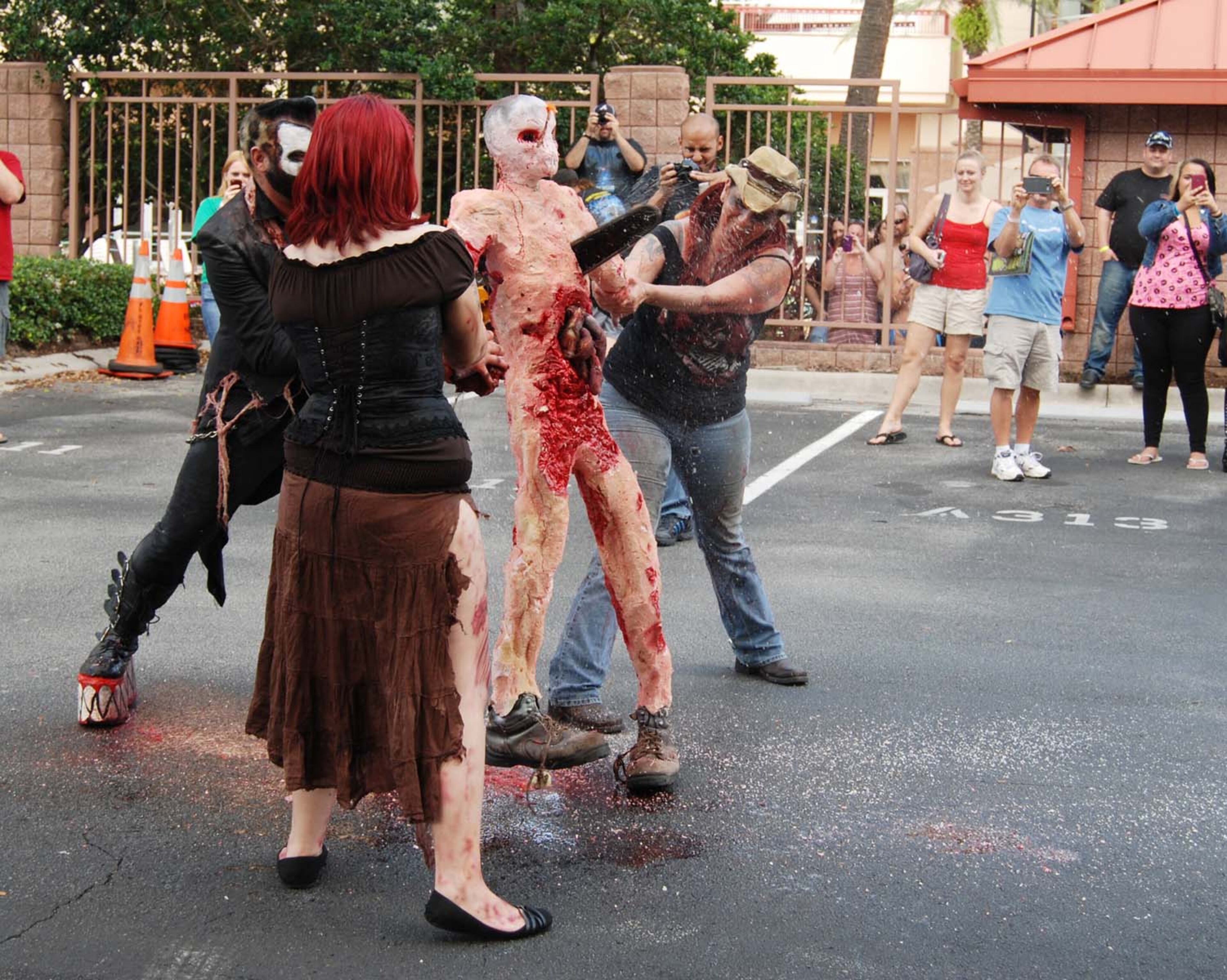 A pack of blood-thirsty zombies marched on the Rosen Centre Hotel in Orlando, Florida to kick off Spooky Empire's annual May-Hem horror convention.