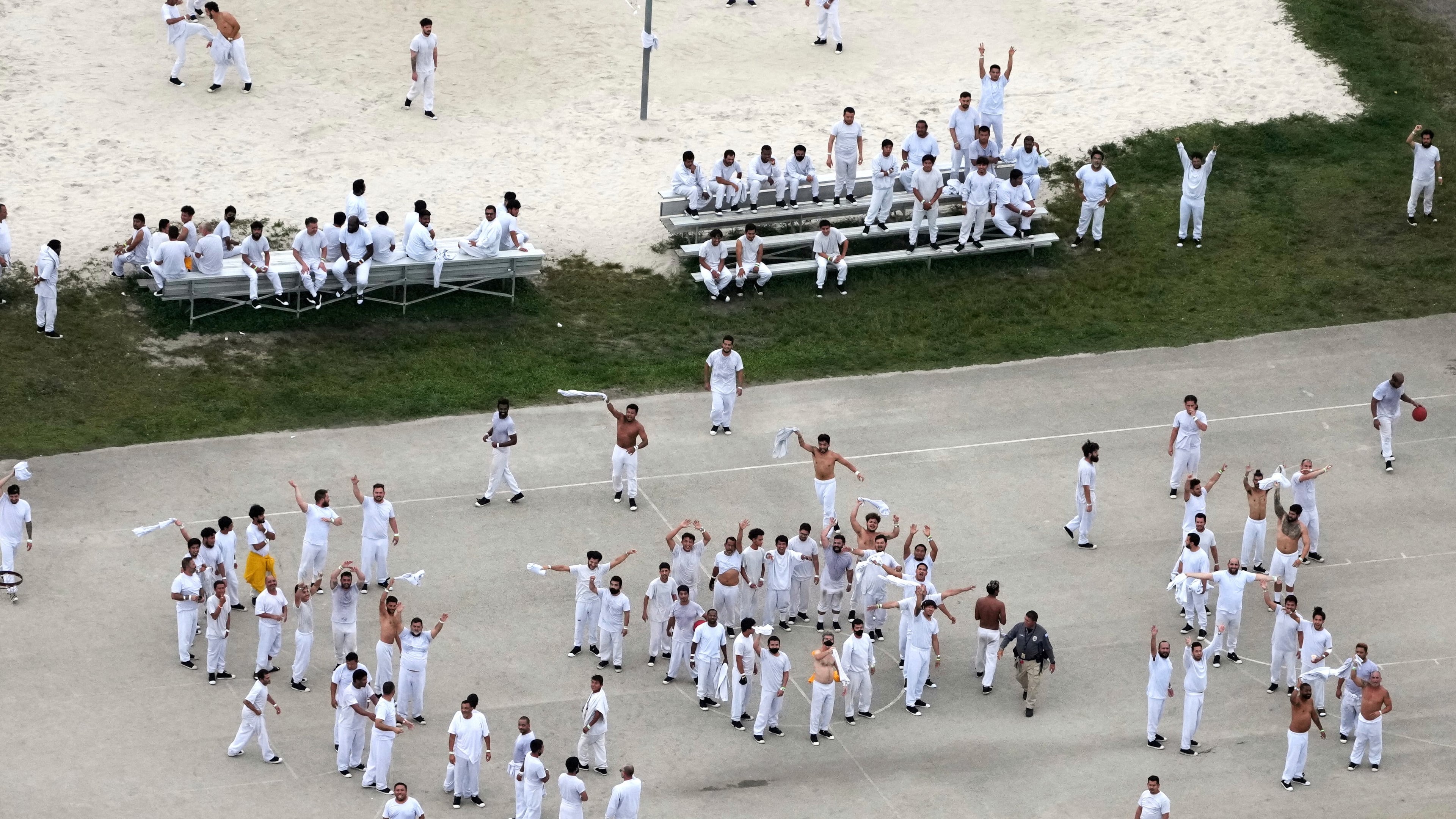 FILE - Detainees wave and spell out a rough SOS to a helicopter flying overhead, at U.S. Immigration and Customs Enforcement's Krome Detention Center, Friday, July 4, 2025, in Miami. (AP Photo/Rebecca Blackwell, File)