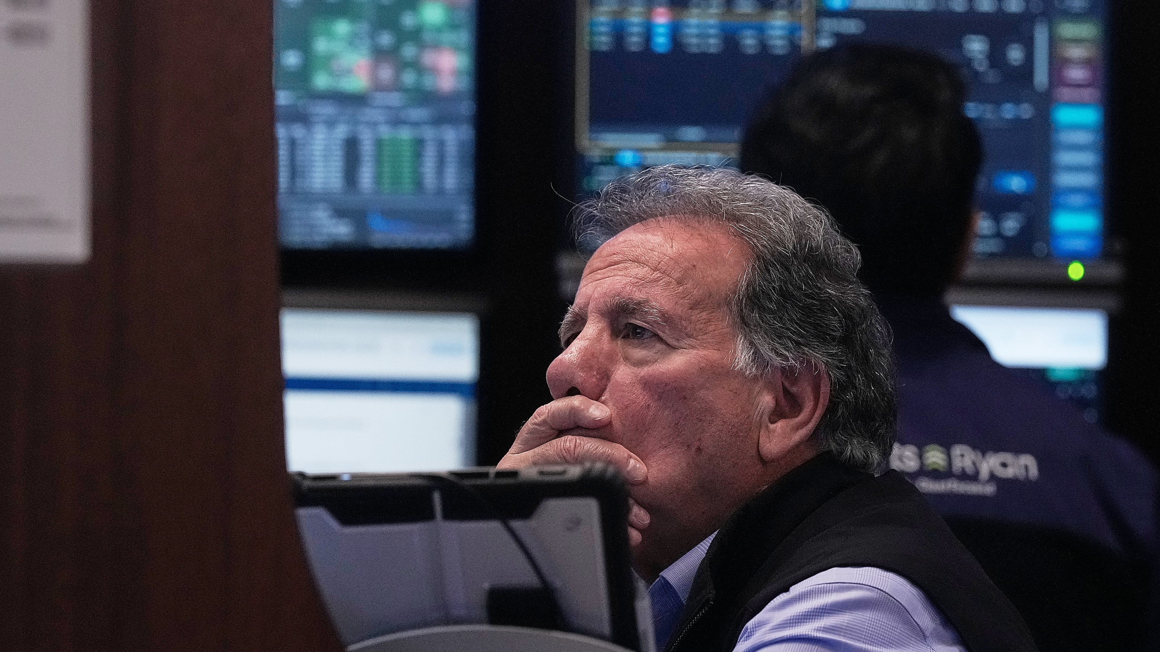Trader Sal Suarino works on the floor of the New York Stock Exchange, Monday, Jan. 12, 2026. (AP Photo/Richard Drew)