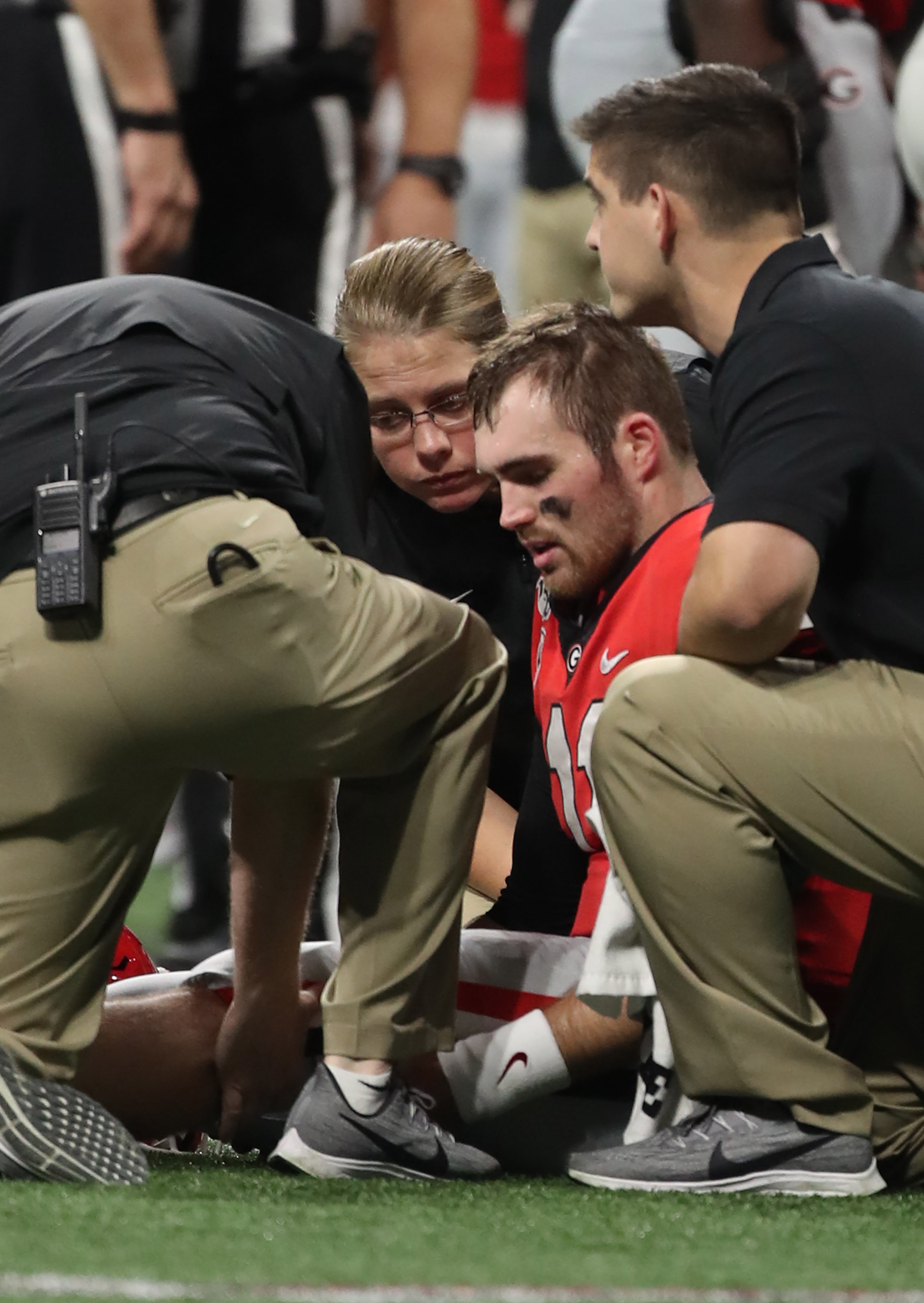 Georgia Bulldogs quarterback Jake Fromm (11) is injured during the first half of the Georgia vs. LSU SEC Football Championship game at Mercedes-Benz Stadium in Atlanta. Alyssa Pointer / alyssa.pointer@ajc.com