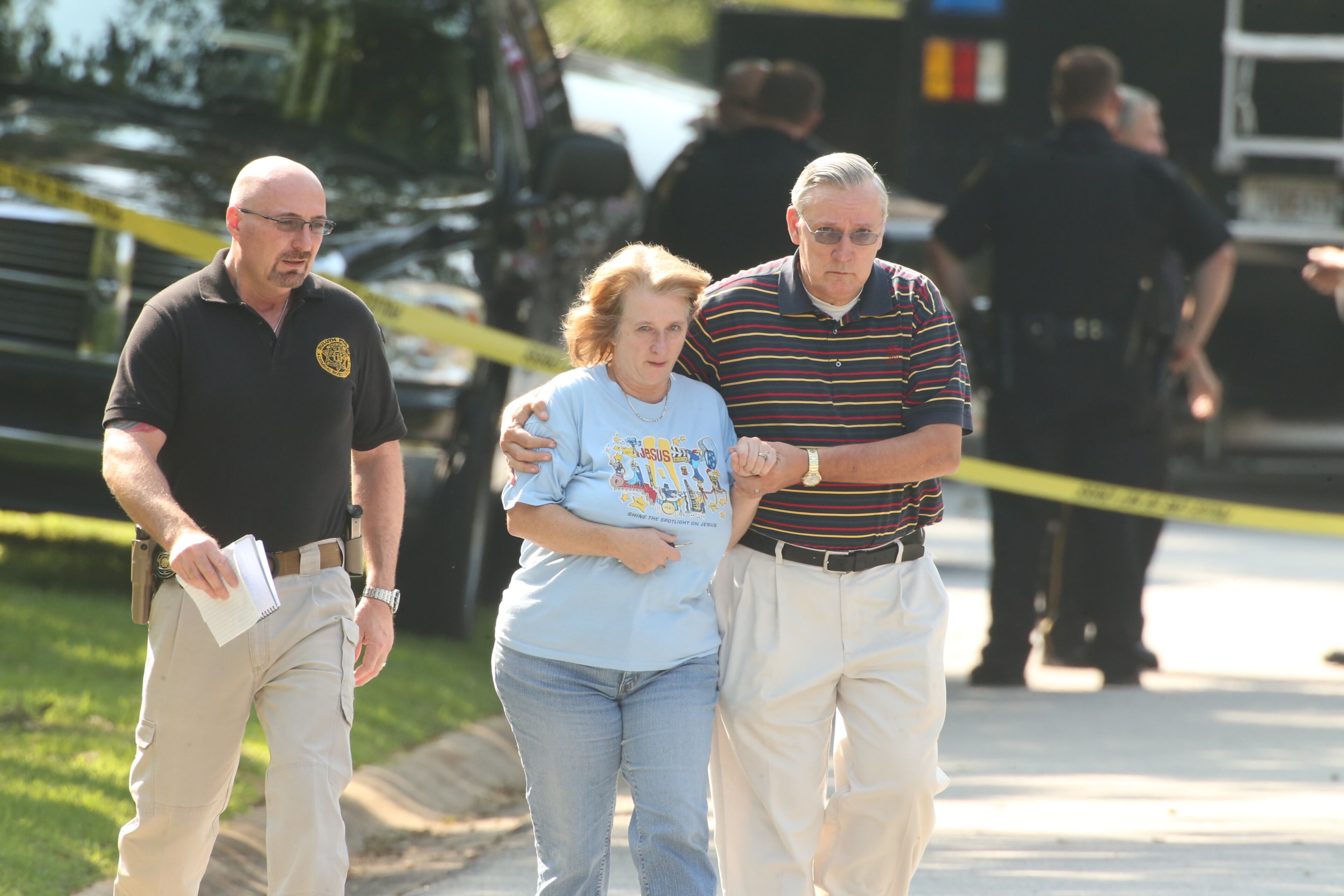 Police are on the scene of a deadly home invasion in which a man was killed and a woman and child were shot and wounded in Duluth on August 6, 2014. JOHN SPINK/JSPINK@AJC.COM