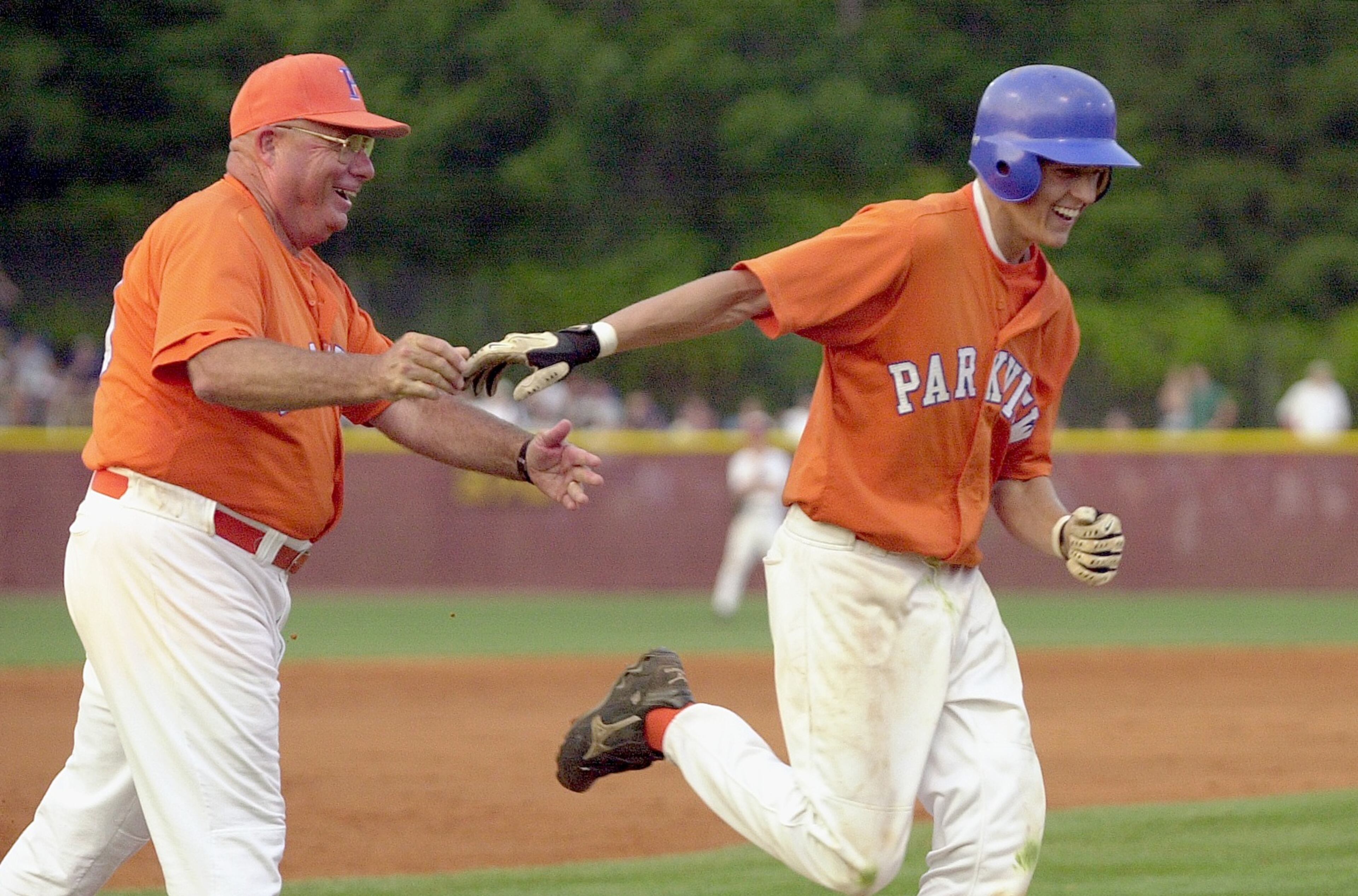 Parkview's Jeff Francoeur celebrates with coach Hugh Buchanan after a homer in 2002. (SUNNY SUNG/STAFF)
