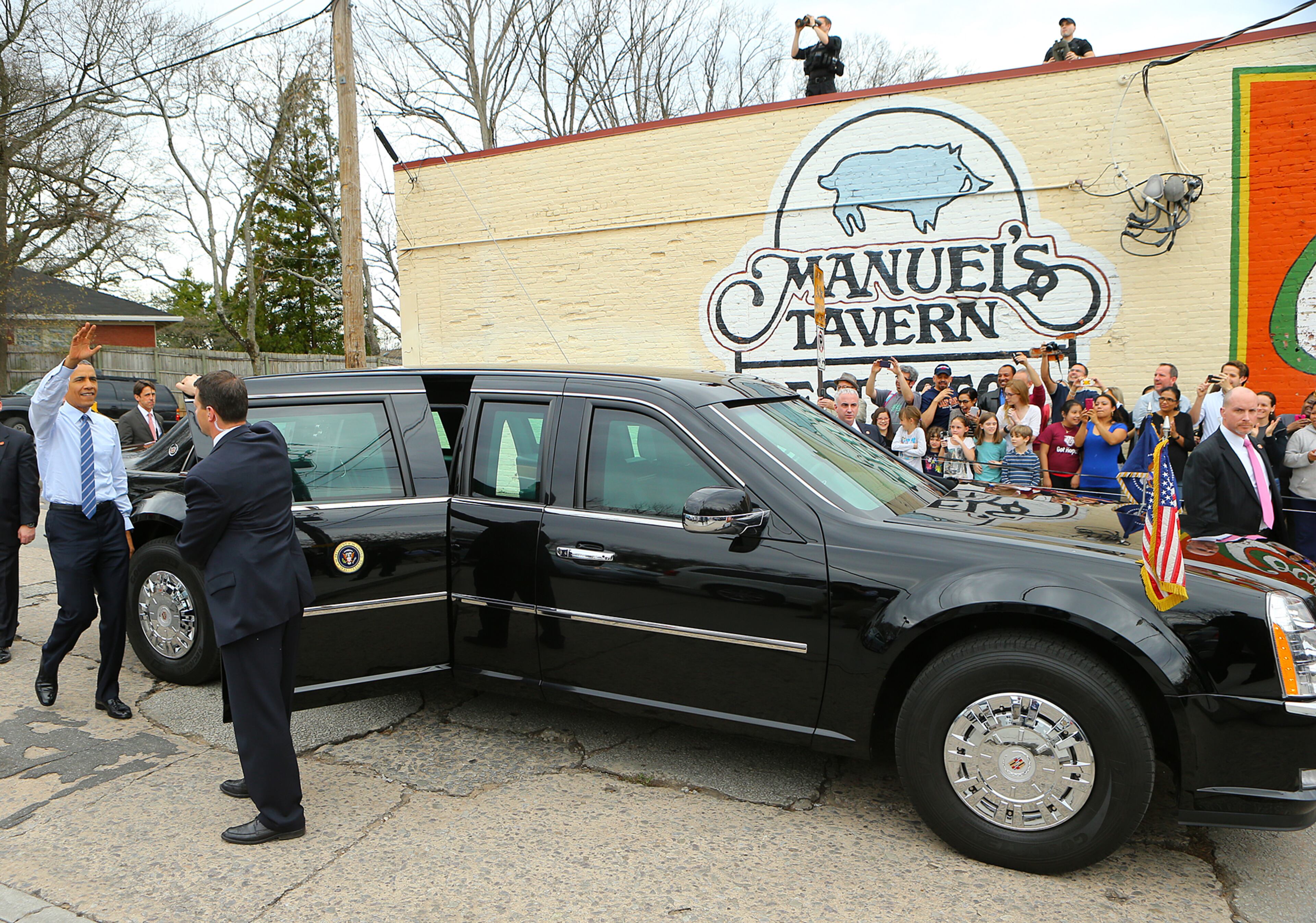 President Barack Obama waves to the crowd as he leaves Manuel's Tavern on Tuesday, March 10, 2015, in Atlanta. Curtis Compton / ccompton@ajc.com