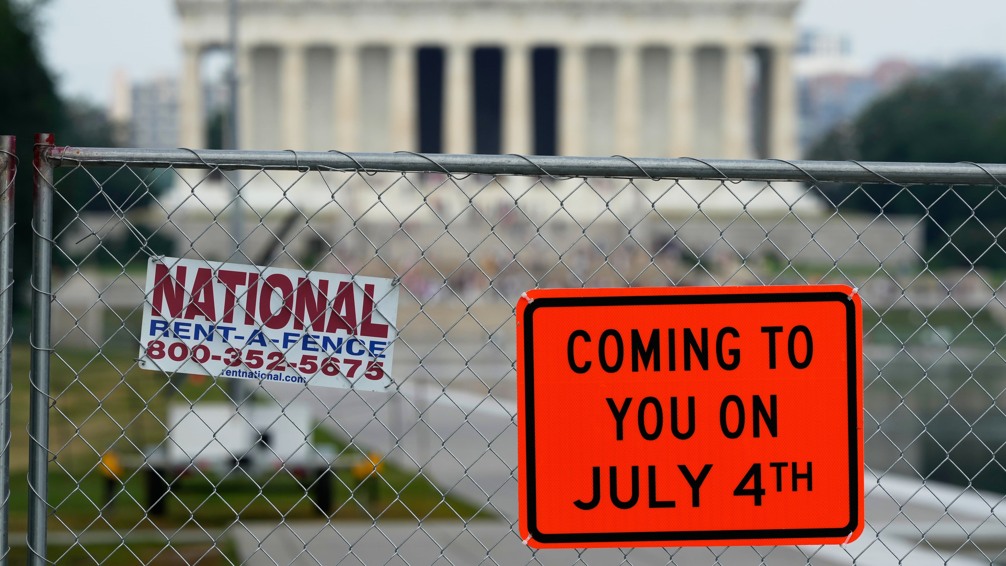 Signs are posted on a chain link fence around the Lincoln Memorial Reflecting Pool Friday, June 26, 2026, in Washington. (AP Photo/Carolyn Kaster)