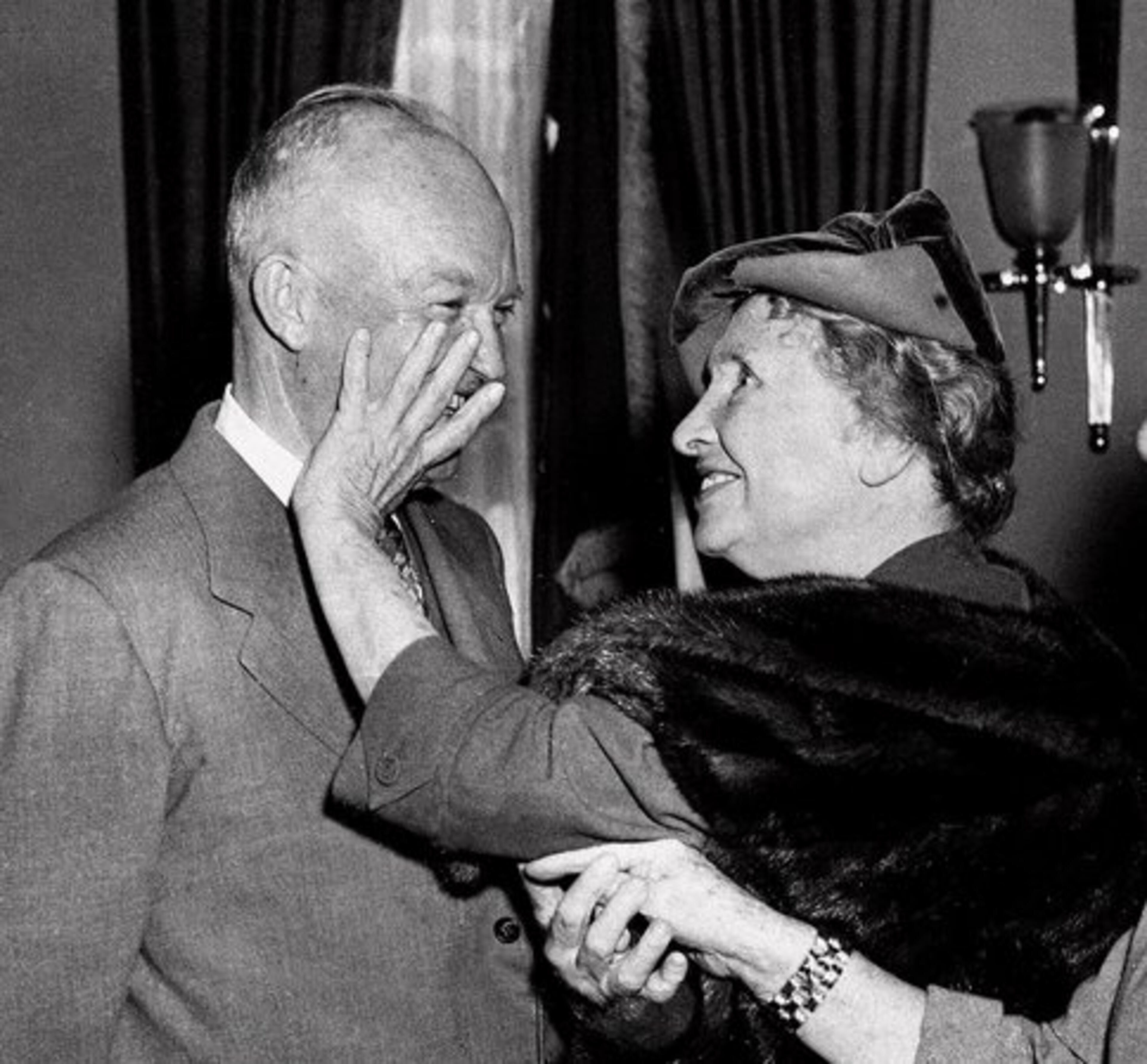 KELLER USES her fingers to "see" President Eisenhower in a 1953 visit to the White House.