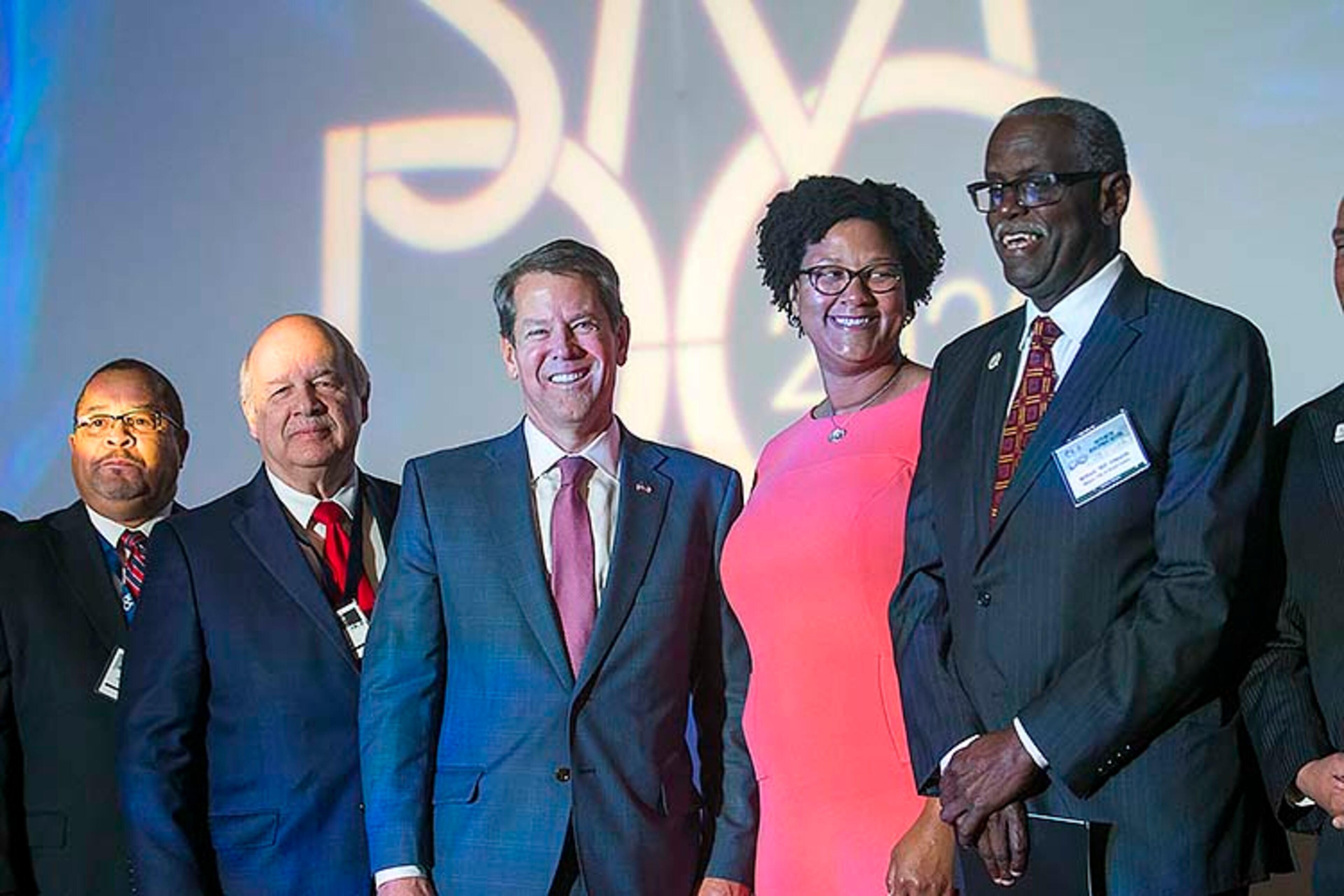 02/20/2020 -- College Park, Georgia -- Georgia Gov. Brian Kemp (third from left) stands with leaders and government officials from Atlanta's South Metro region during the 18th annual South Metro Development Outlook Conference at the Georgia International Convention Center in College Park, Thursday, February 20, 2020. (ALYSSA POINTER/ALYSSA.POINTER@AJC.COM)
