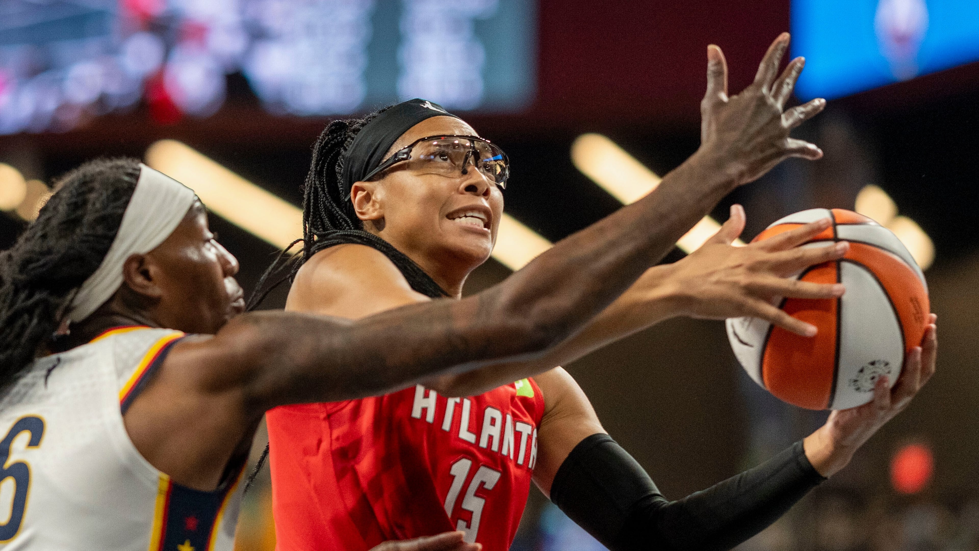 FILE - Atlanta Dream guard Allisha Gray (15) attempts a basket against Indiana Fever forward Natasha Howard (6) during the first half of Game 1 in the first round of the WNBA basketball playoffs, Sep. 14, 2025, in Atlanta. (AP Photo/Erik Rank, File)