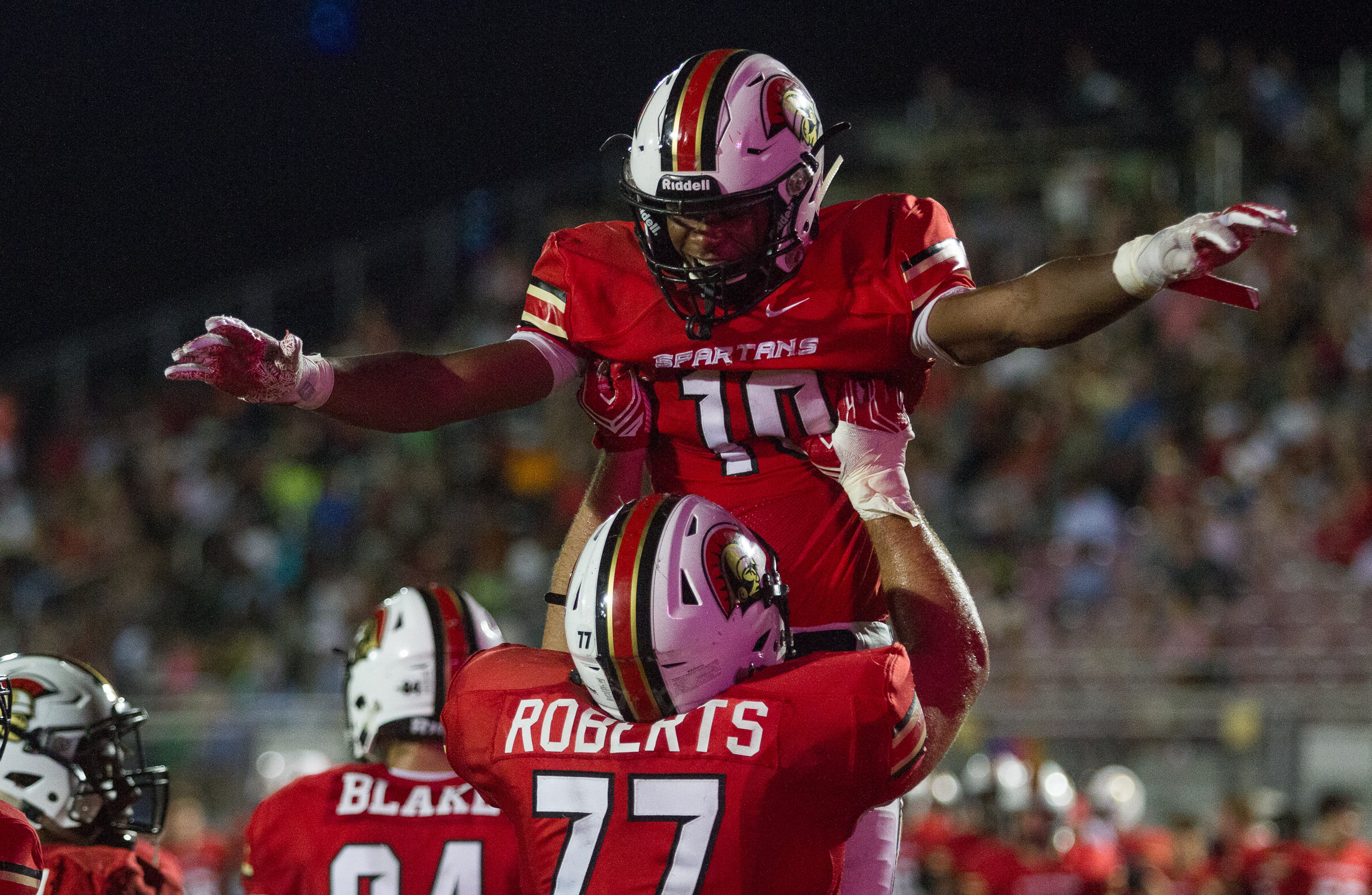 Greater Atlanta Christian School's Alex Boglin (10) and Ford Roberts (77) celebrate in the end zone after Boglin scored a touchdown during the third quarter of their game with Westminster in Norcross Ga Friday, August 25, 2017. GAC defeated Westminster 41-7. STEVE SCHAEFER / SPECIAL TO THE AJC