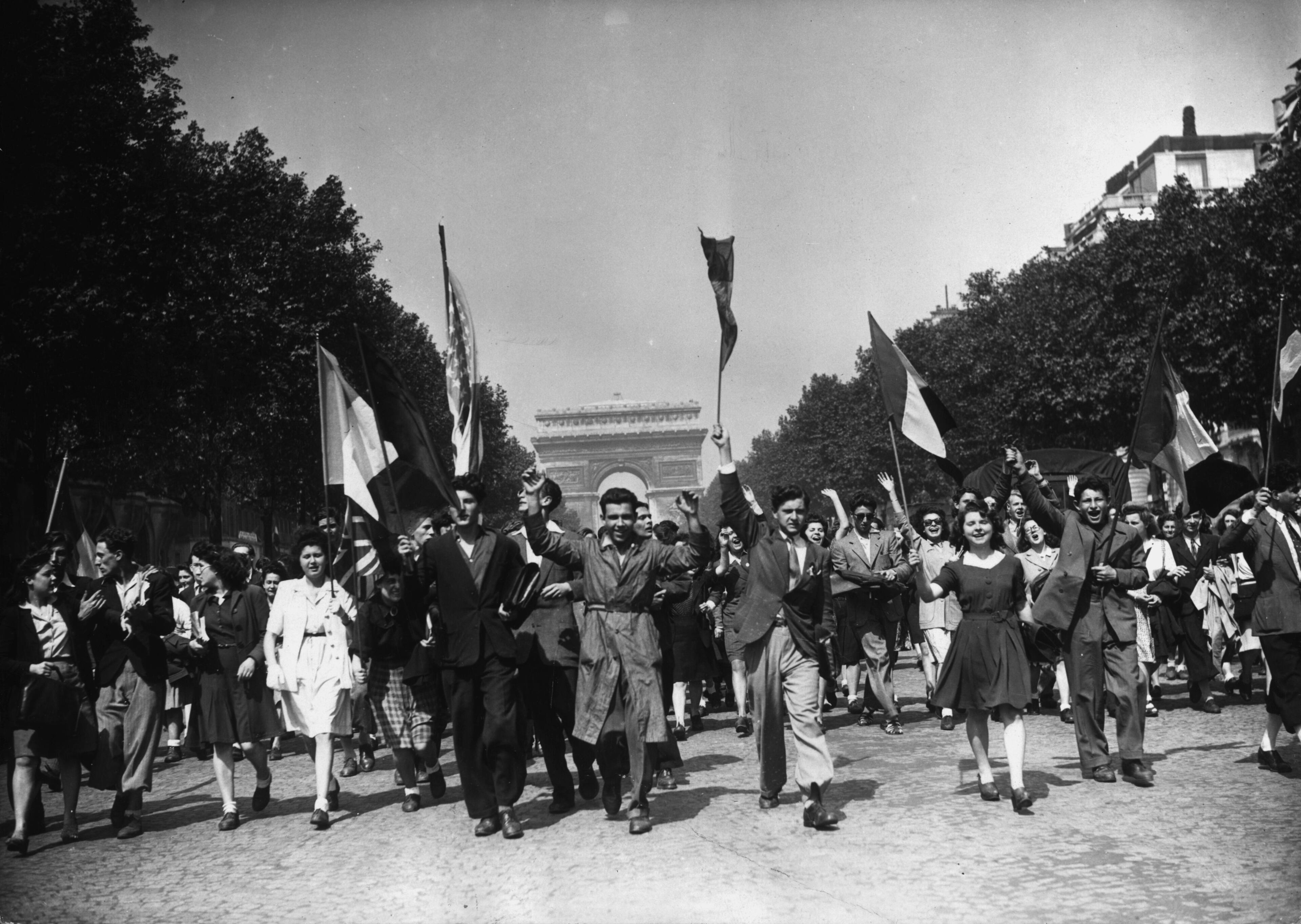 May 8, 2015, marks the 70th anniversary of V.E. Day. This was the day that marked the official end to the war in Europe, bringing huge numbers out onto the streets to celebrate victory. The crowds in London were famously joined by Princess Margaret and Princess Elizabeth, who would later become queen. (Photo by Keystone/Getty Images)