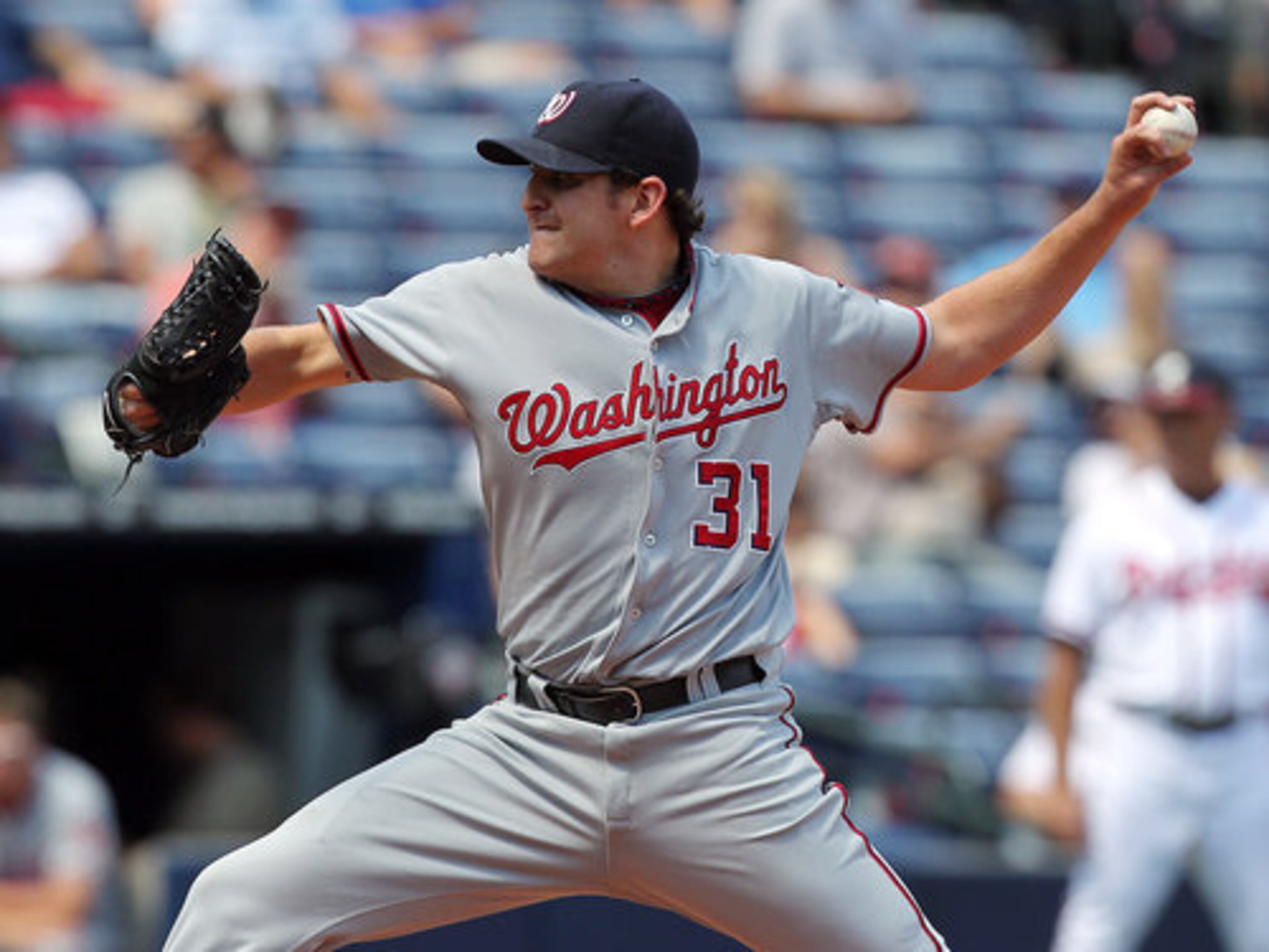 Washington Nationals starting pitcher John Lannan delivers a pitch against the Atlanta Braves during 4th inning action at Turner Field in Atlanta on Wednesday, Sept. 15, 2010.