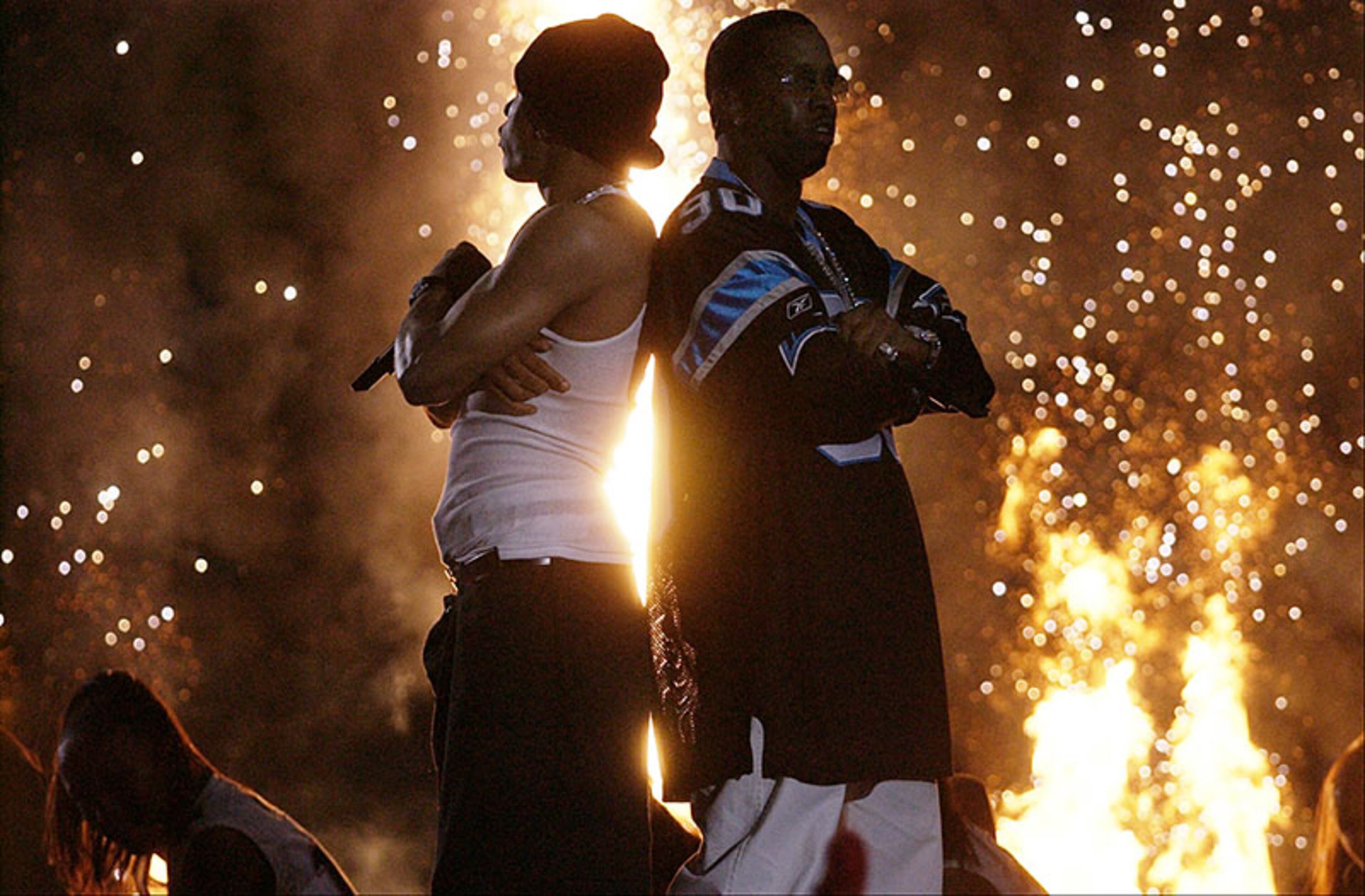 ... Then R&Bers Nelly (left) and P.Diddy crashed the stage ...