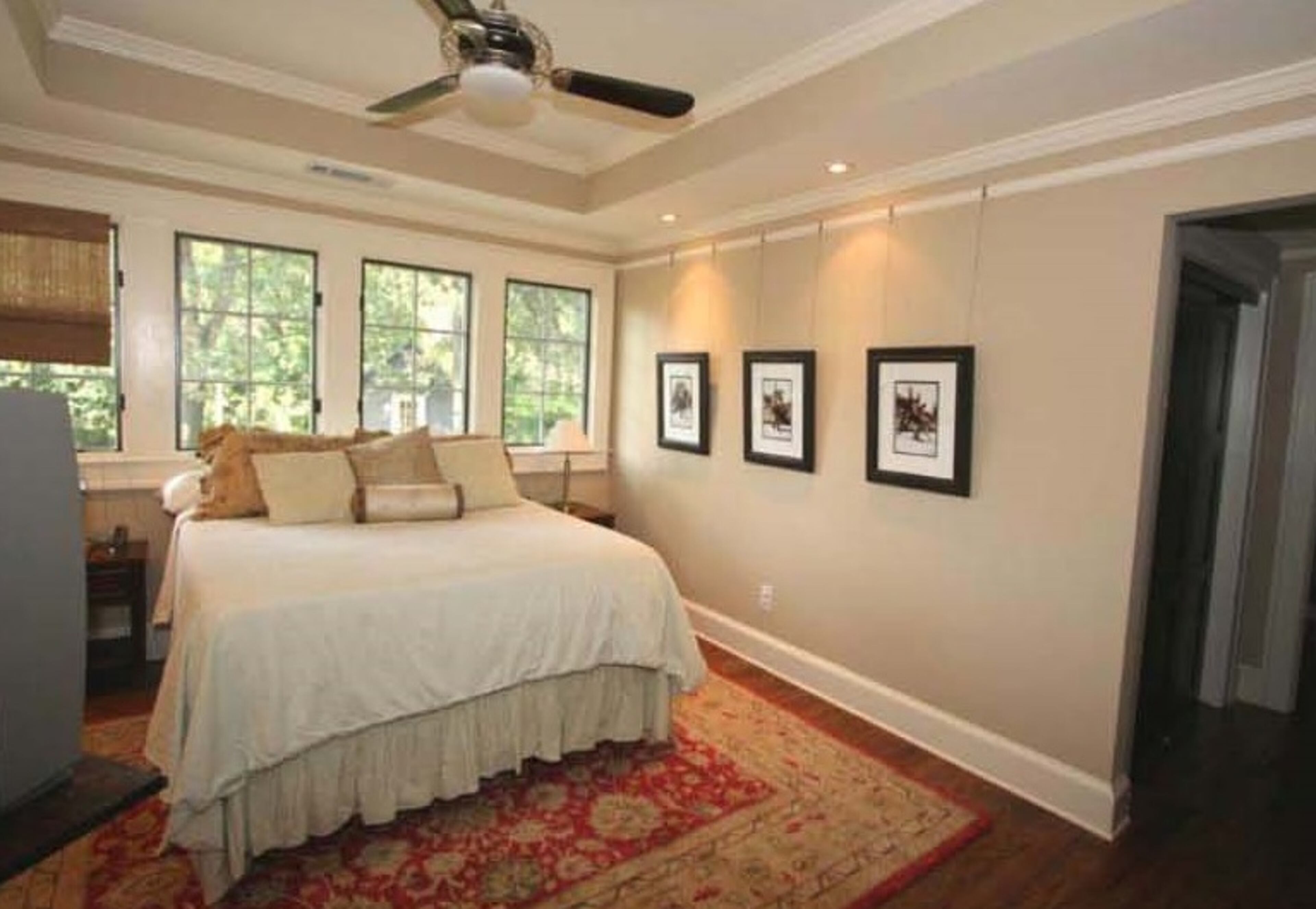 The new master bedroom is a serene sanctuary. Its oak floors, natural light and arched bookshelves tie in to the rest of the home.