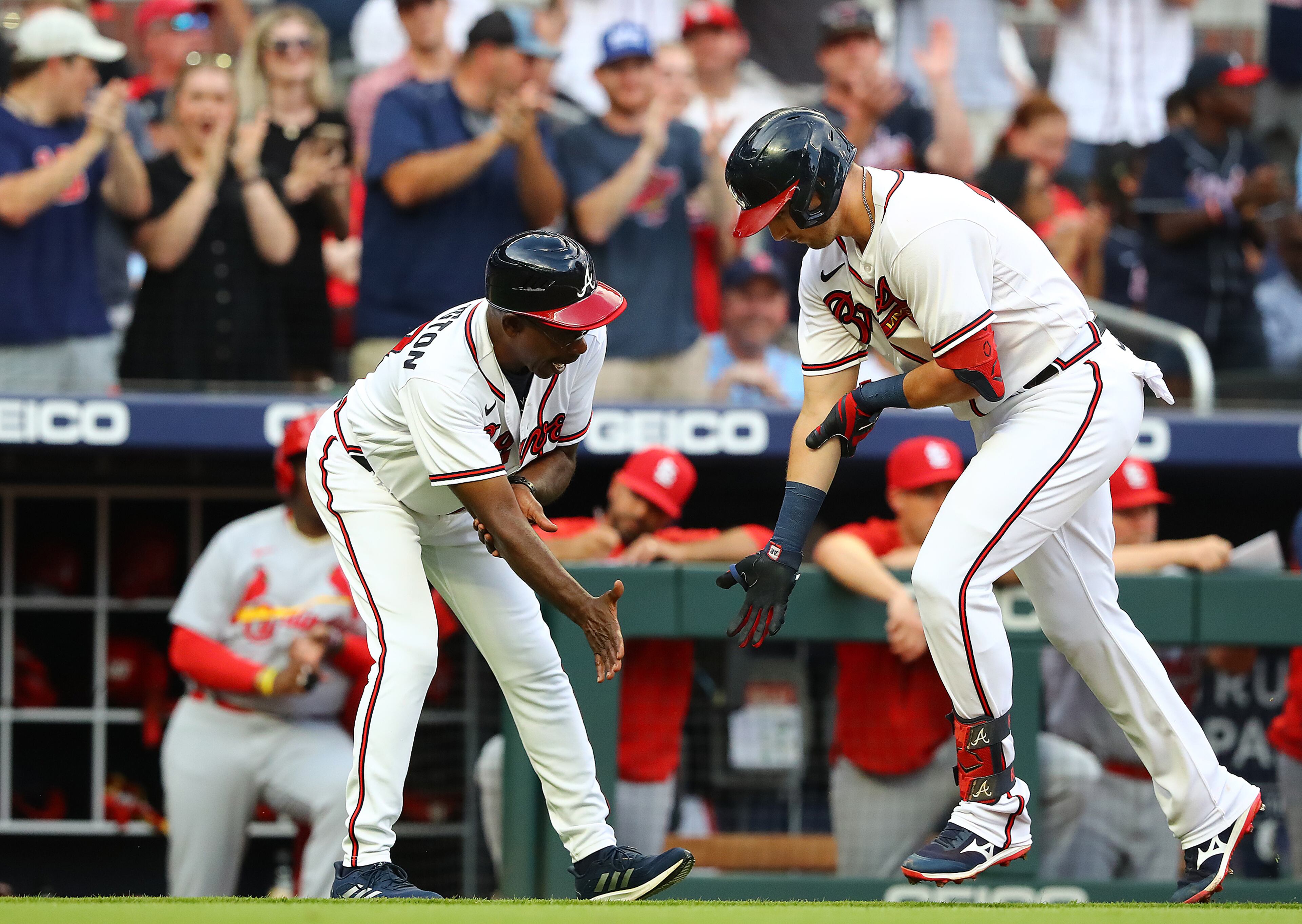 Braves third baseman Austin Riley gets five from third base coach Ron Washington hitting a 2-RBI home run to take a 3-1 lead over the St. Louis Cardinals during the first inning in a MLB baseball game on Tuesday, July 5, 2022, in Atlanta. “Curtis Compton / Curtis.Compton@ajc.com”