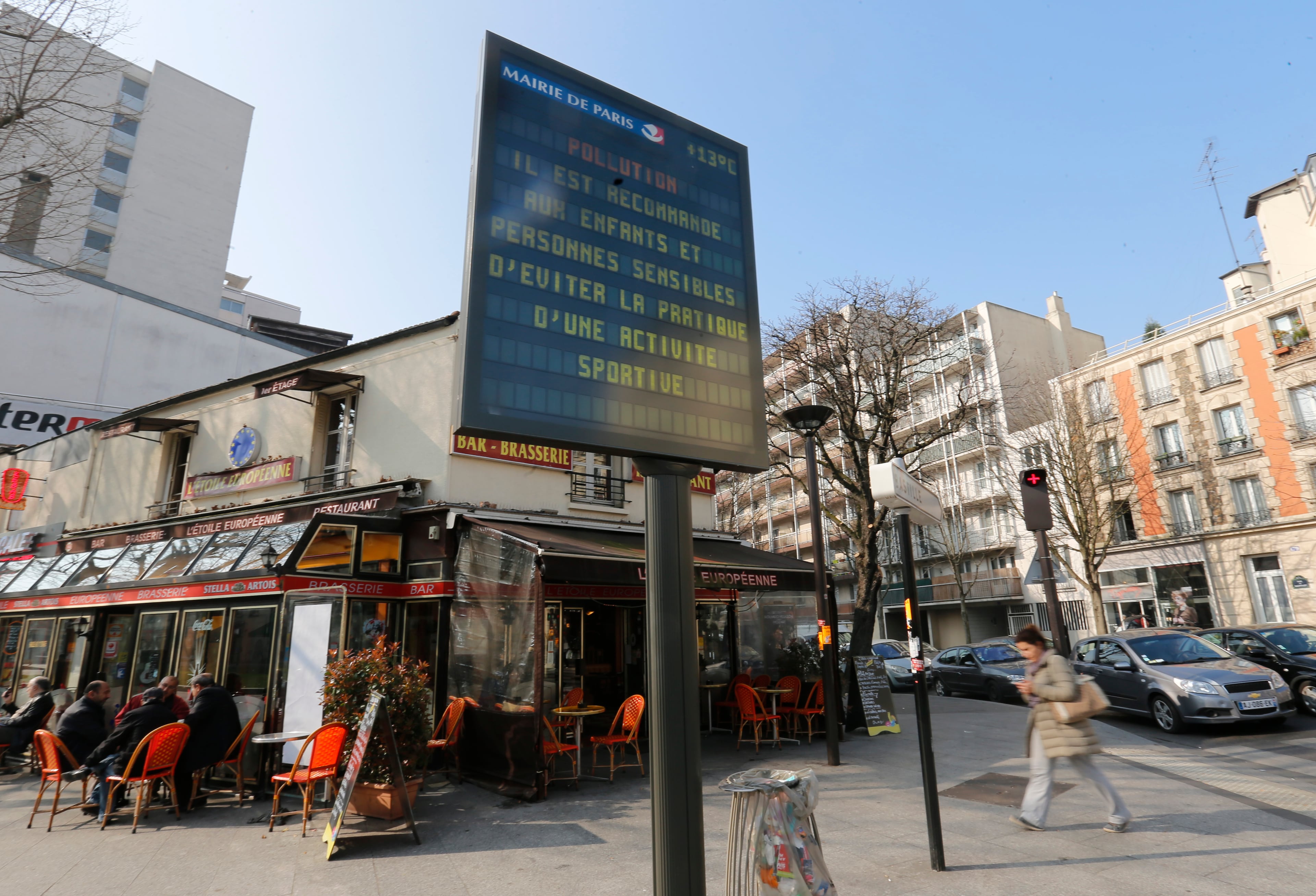 A city electronic board reads "Pollution, we recommend to children and sensitive people not to practice any sports activity", Friday March 14, 2014 in Paris. Air pollution that has turned Paris skies a murky yellow is giving a break to millions of French travelers -- all public transportation in the Paris region and two other cities is free for the next three days. Nearly three-quarters of France is under alert in what the European Environment Agency says is the worst air pollution since 2007.