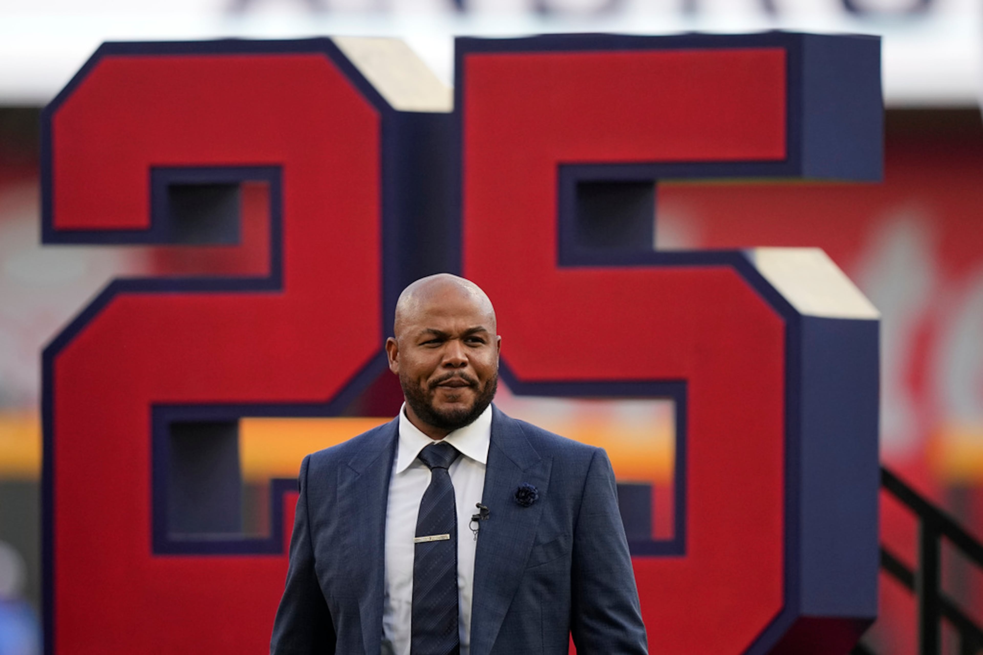 Andruw Jones walks on the field as he is honored, Saturday, Sept. 9, 2023, in Atlanta. Jones who won 10 Gold Gloves in a career that began with 12 seasons in Atlanta, became the 11th Braves player or manager to have his number retired on Saturday night. The honor could add momentum to his candidacy for the Baseball Hall of Fame. Jones' 25 was retired before the Braves' game against the Pittsburgh Pirates. (AP Photo/Brynn Anderson)