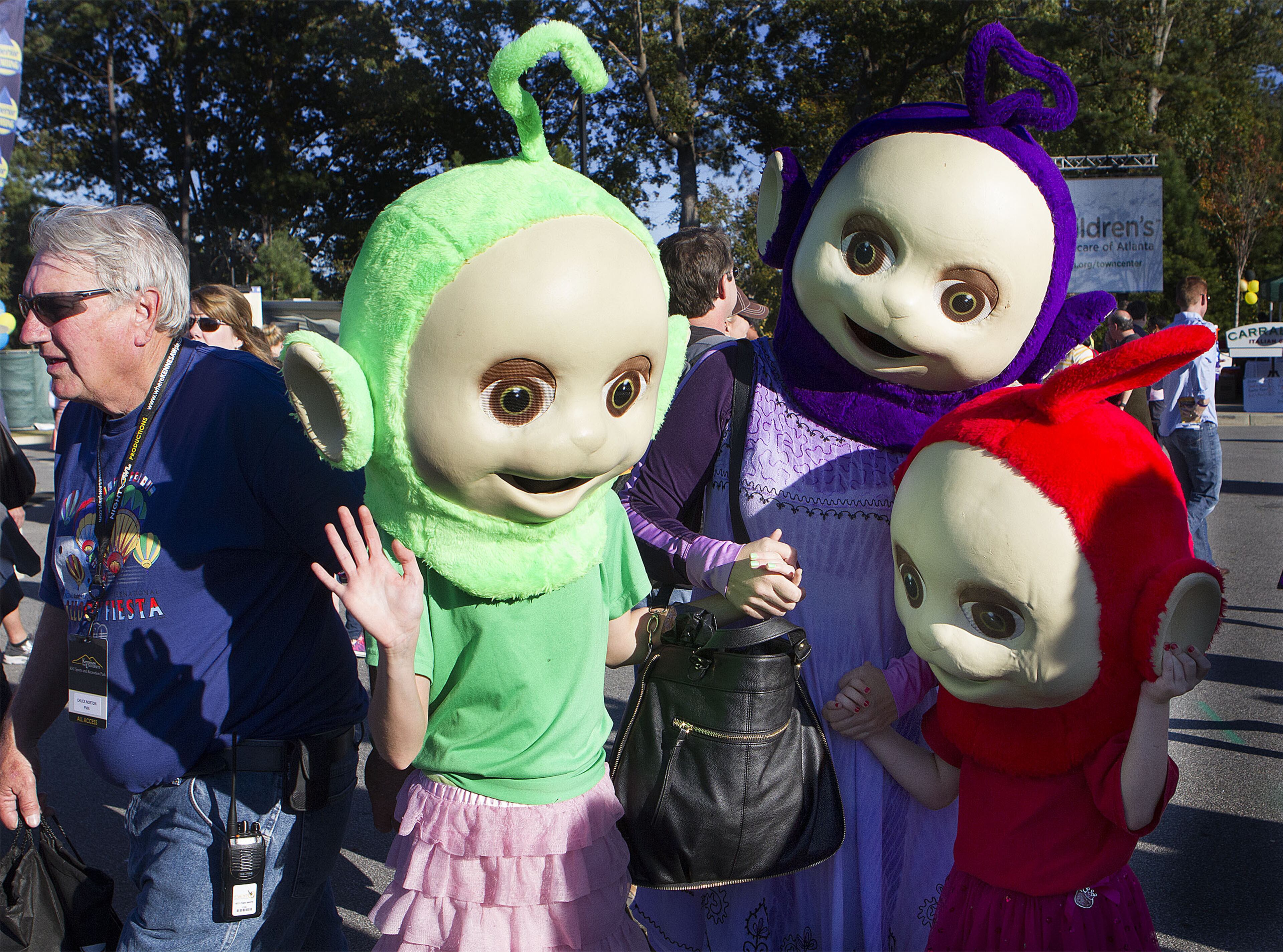 (left to right) Grace Ford (age 11) her mother Noel & sister Laurie (6) dressed as "Teletubies" at the Kennesaw State University Owl-O-Ween, Atlanta's only hot air balloon festival also billed as Atlanta's largest costume party. (Photo by Phil Skinner)