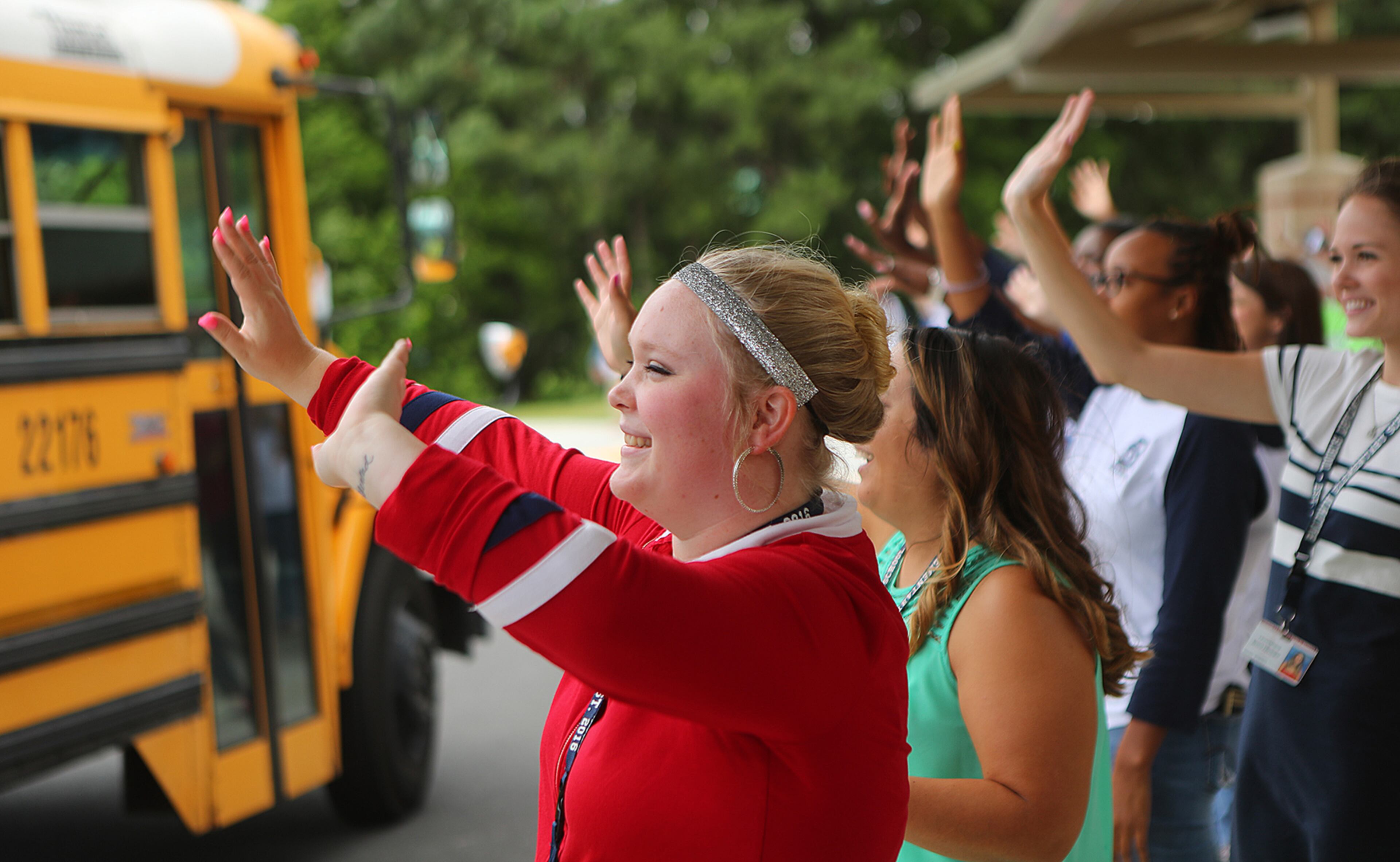 May 24, 2017, Norcross: First year teacher Audrey Smith joins the veteran teachers on the curb cheering as the last school bus pulls away on the last day of school at Baldwin Elementary School on Wednesday, May 24, 2017, in Norcross. Curtis Compton/ccompton@ajc.com
