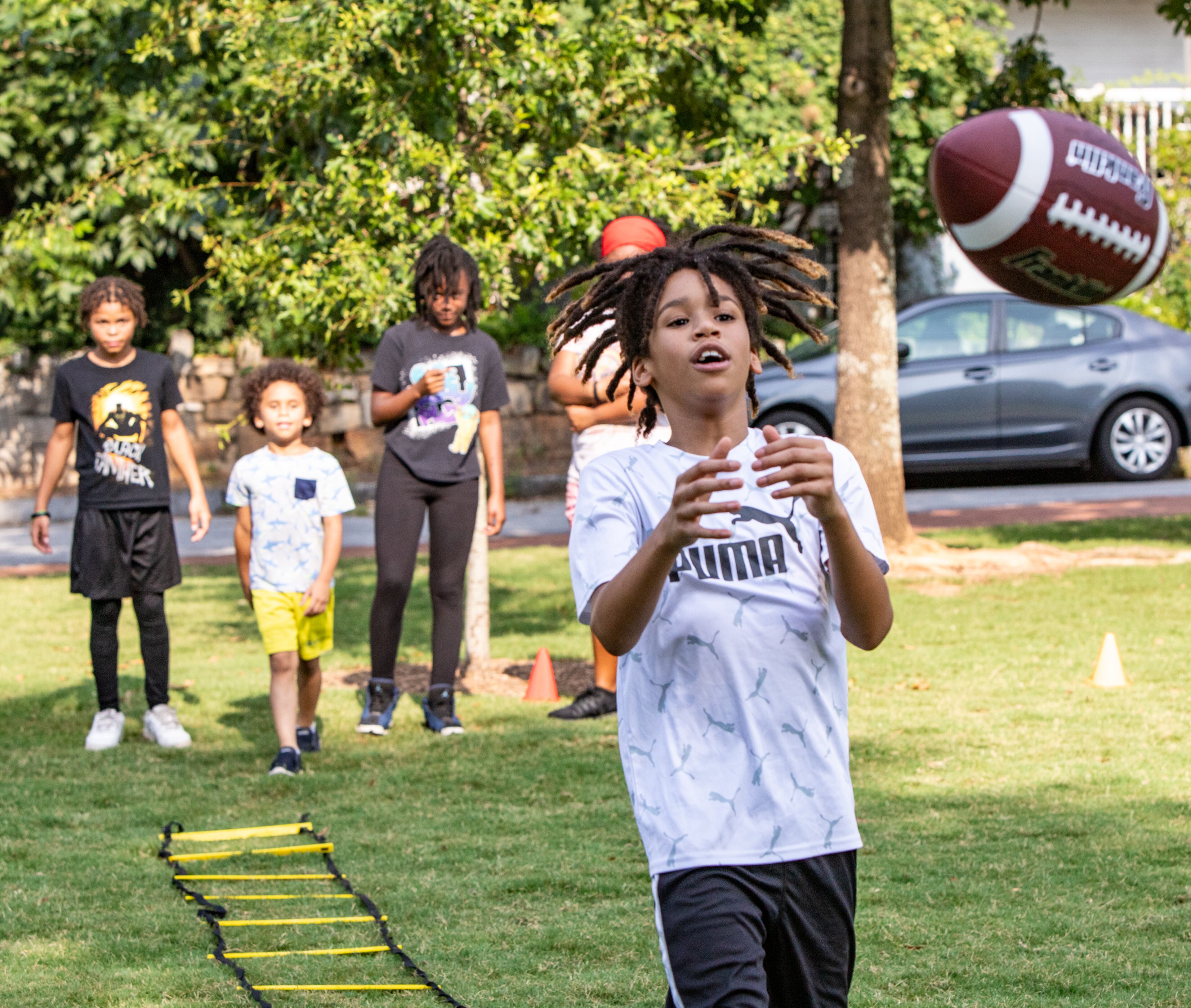 Zion Lawson, 12, finishes a drill. (Jenni Girtman for The Atlanta Journal-Constitution)