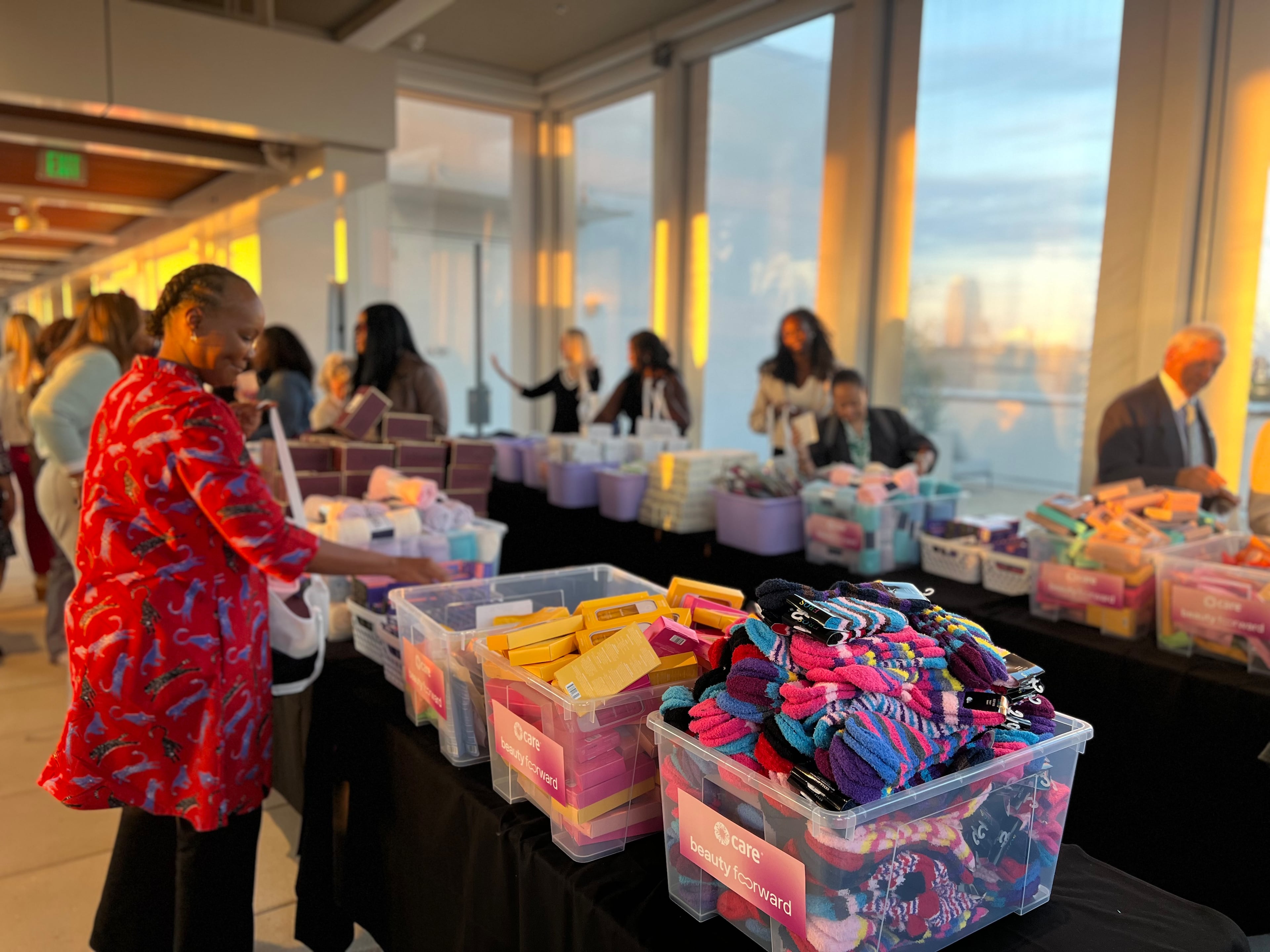 Volunteers assemble CARE packages to help mothers in CARE's maternal health program. (Kelly Yamanouchi/AJC)