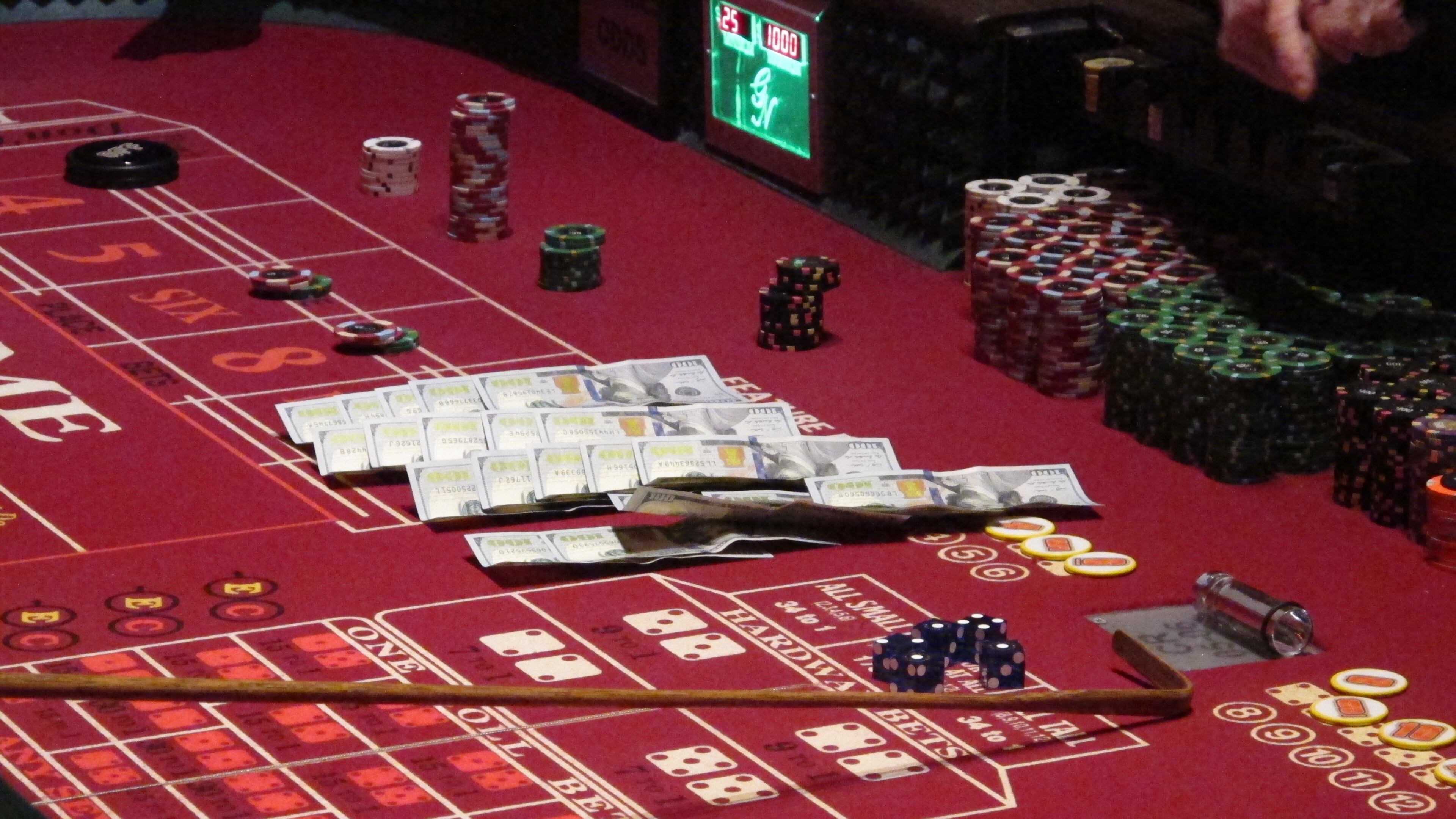 Cash, chips and dice on a craps table at a casino. AP file/Wayne Parry