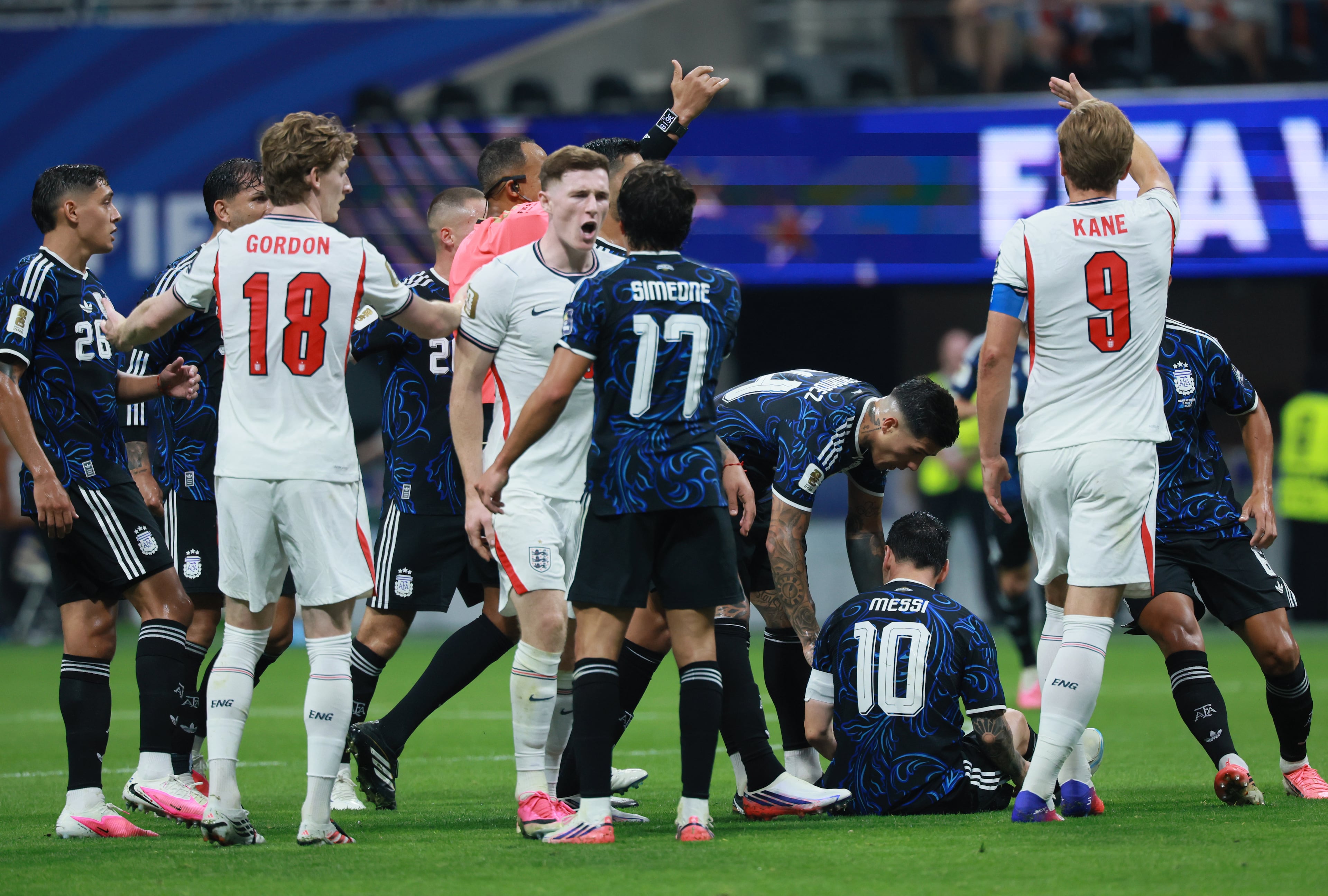 England's Elliot Anderson, center, and Argentina's Giuliano Simeone argue after Anderson fouled Argentina's Lionel Messi during first half of Argentina vs. England FIFA World Cup Semifinal match at Atlanta Stadium (Mercedes-Benz Stadium) on Wednesday, July 15, 2026. (Jason Getz/AJC)