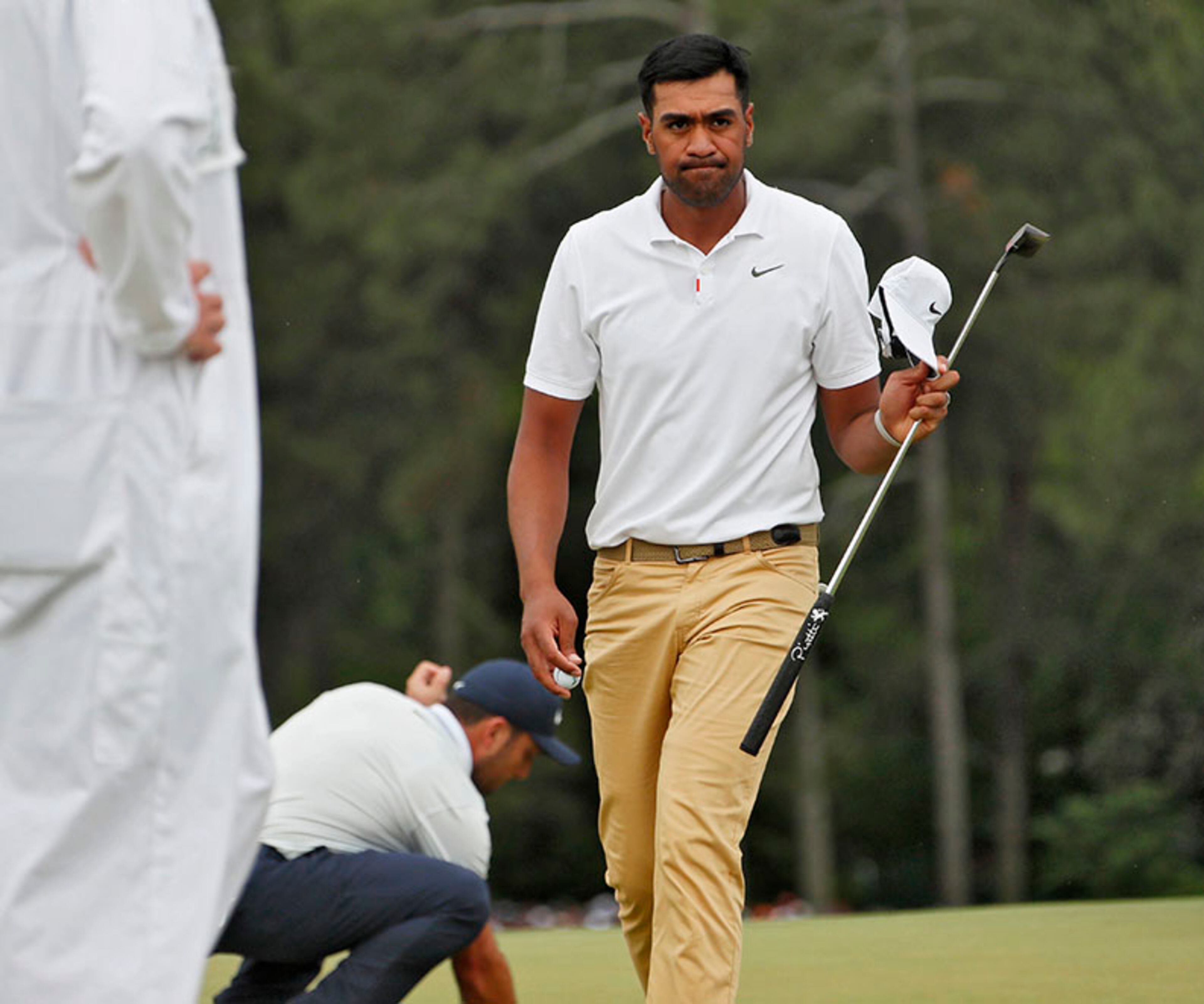 Tony Finau walks off 18 after Tiger Woods won the Masters Tournament Sunday, April 14, 2019, at Augusta National Golf Club in Augusta.