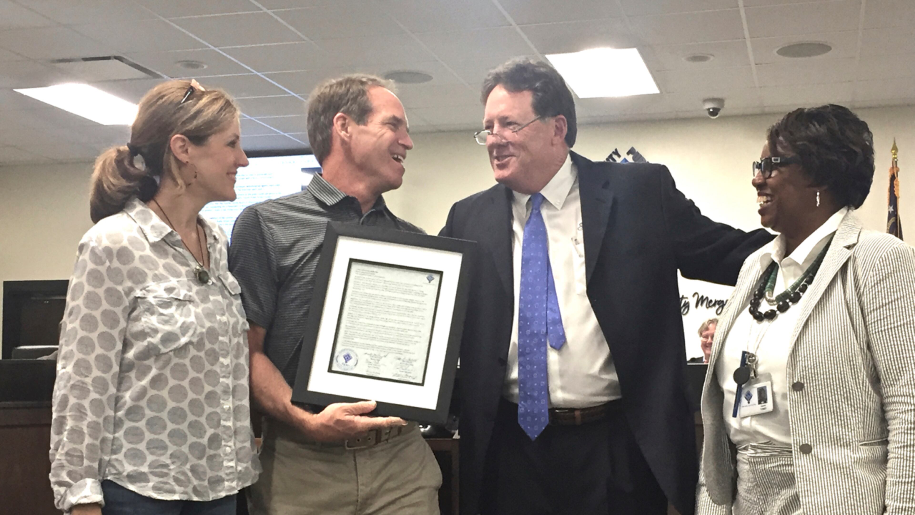 Karen and Dan O’Hara accepted a proclamation from the Fayette County Board of Education honoring their daughter, Kelley. Jill Howard Church for the AJC
